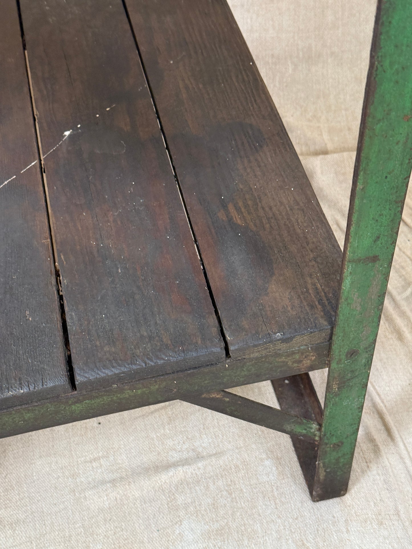 A rustic industrial wooden and metal table.