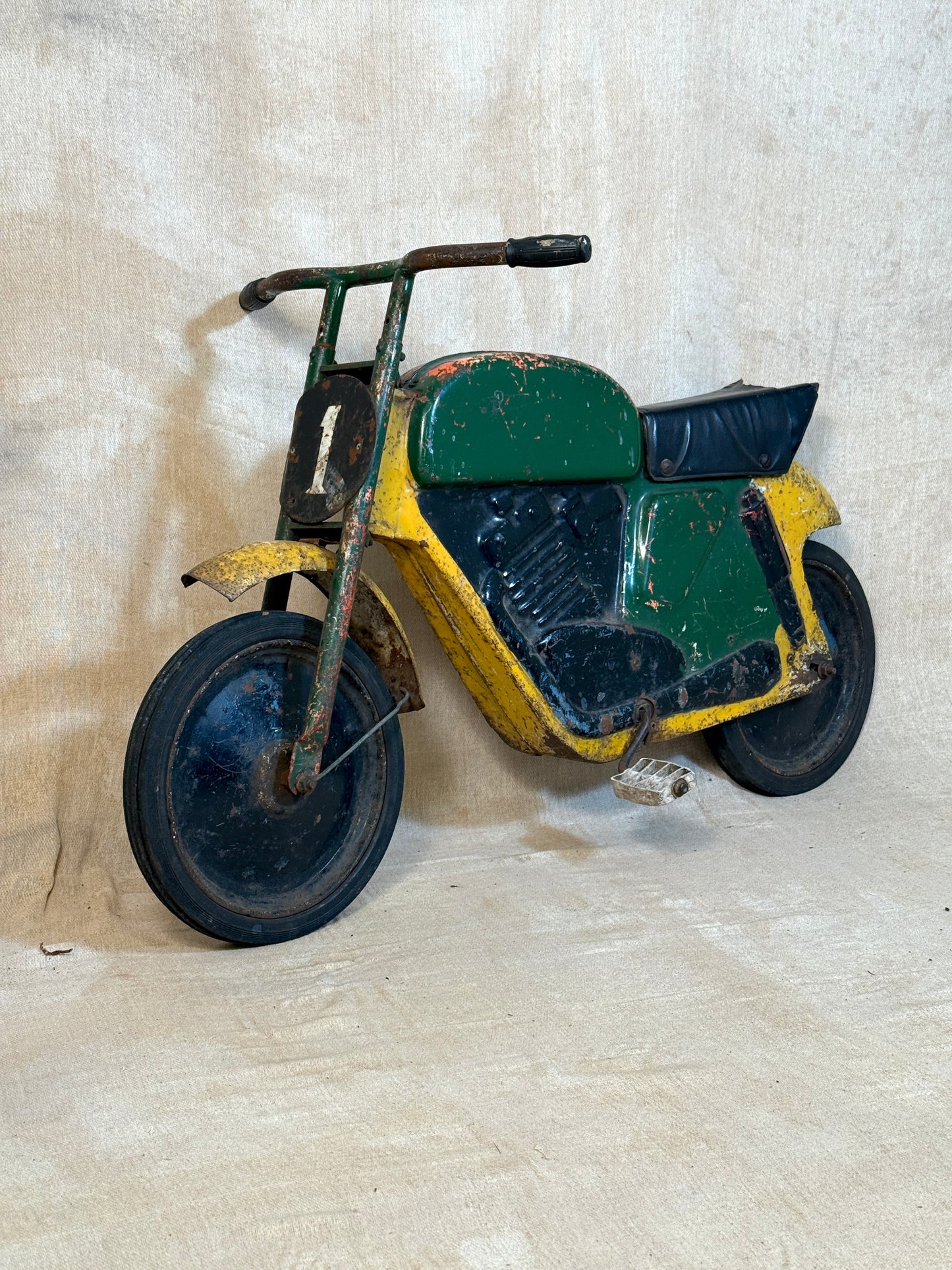 Mobo pressed steel pedal Motorcycle with yellow and green distressed paint.