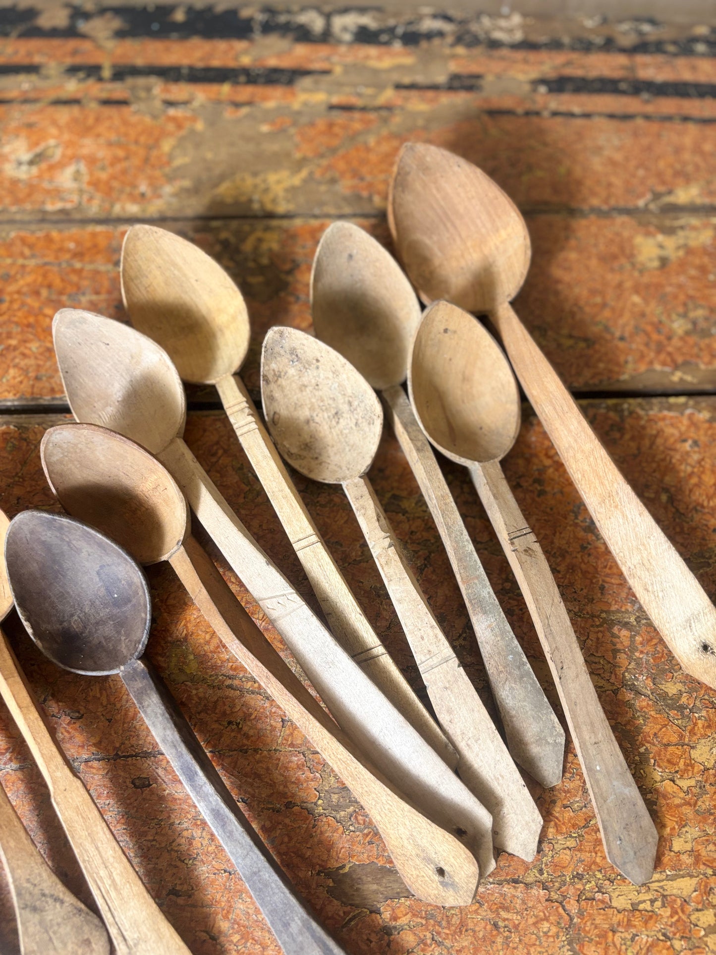 Set of wooden spoons on a rustic wooden surface