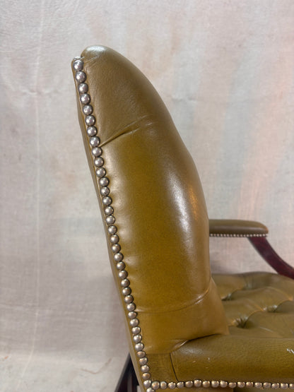 A Green Button Back Armchair