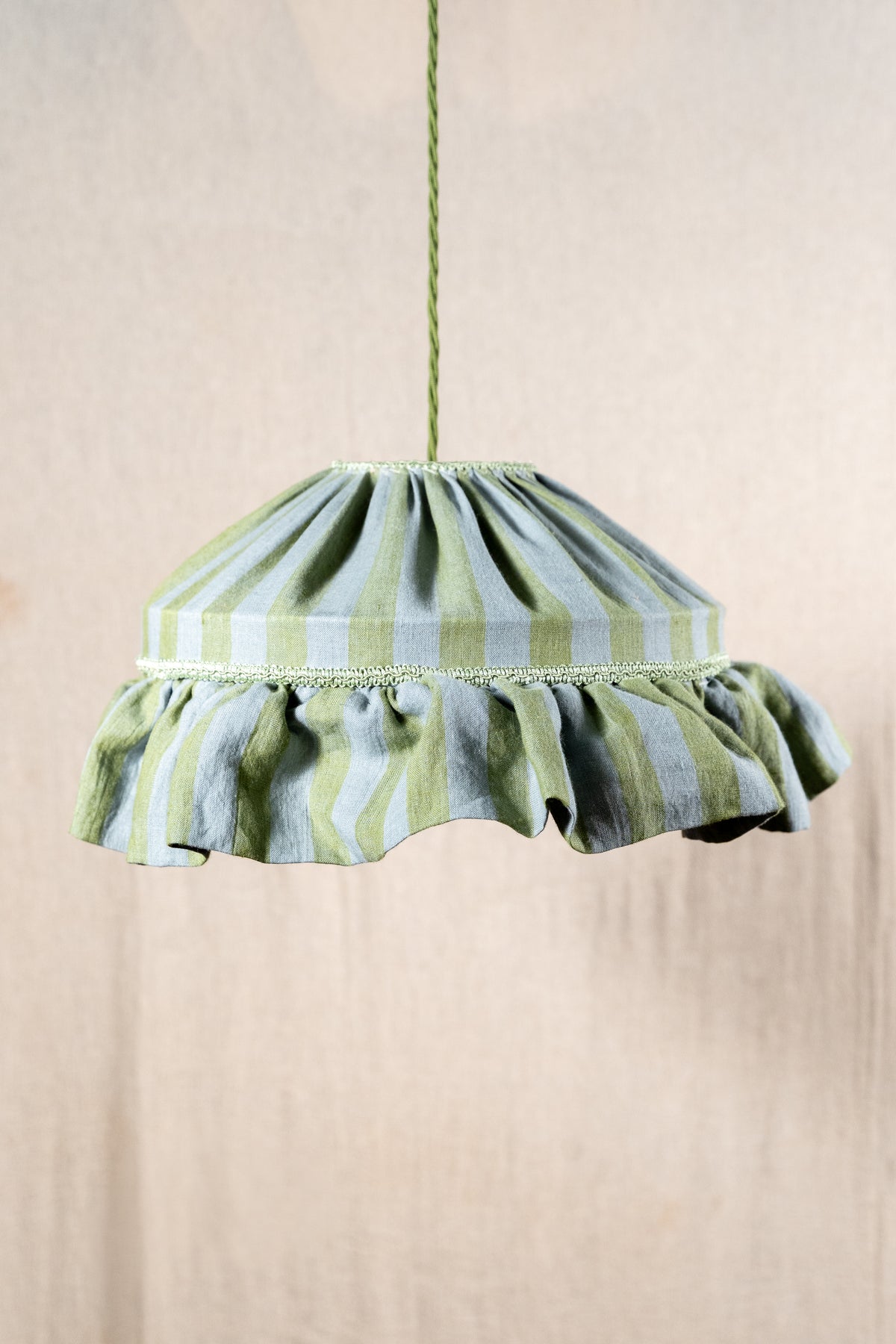 Handmade 12-inch linen carousel shade with sage green and soft blue stripes, vintage trim and pendant fitting. Cosy cottage style.