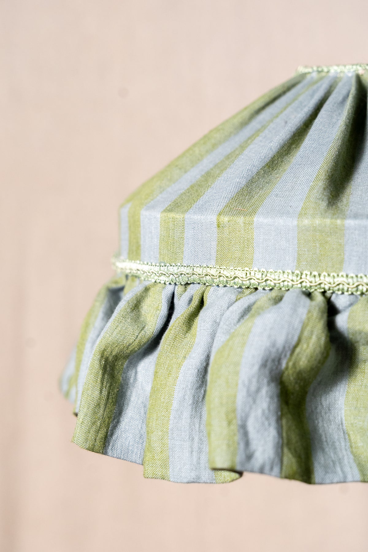 Handmade 12-inch linen carousel shade with sage green and soft blue stripes, vintage trim and pendant fitting. Cosy cottage style.