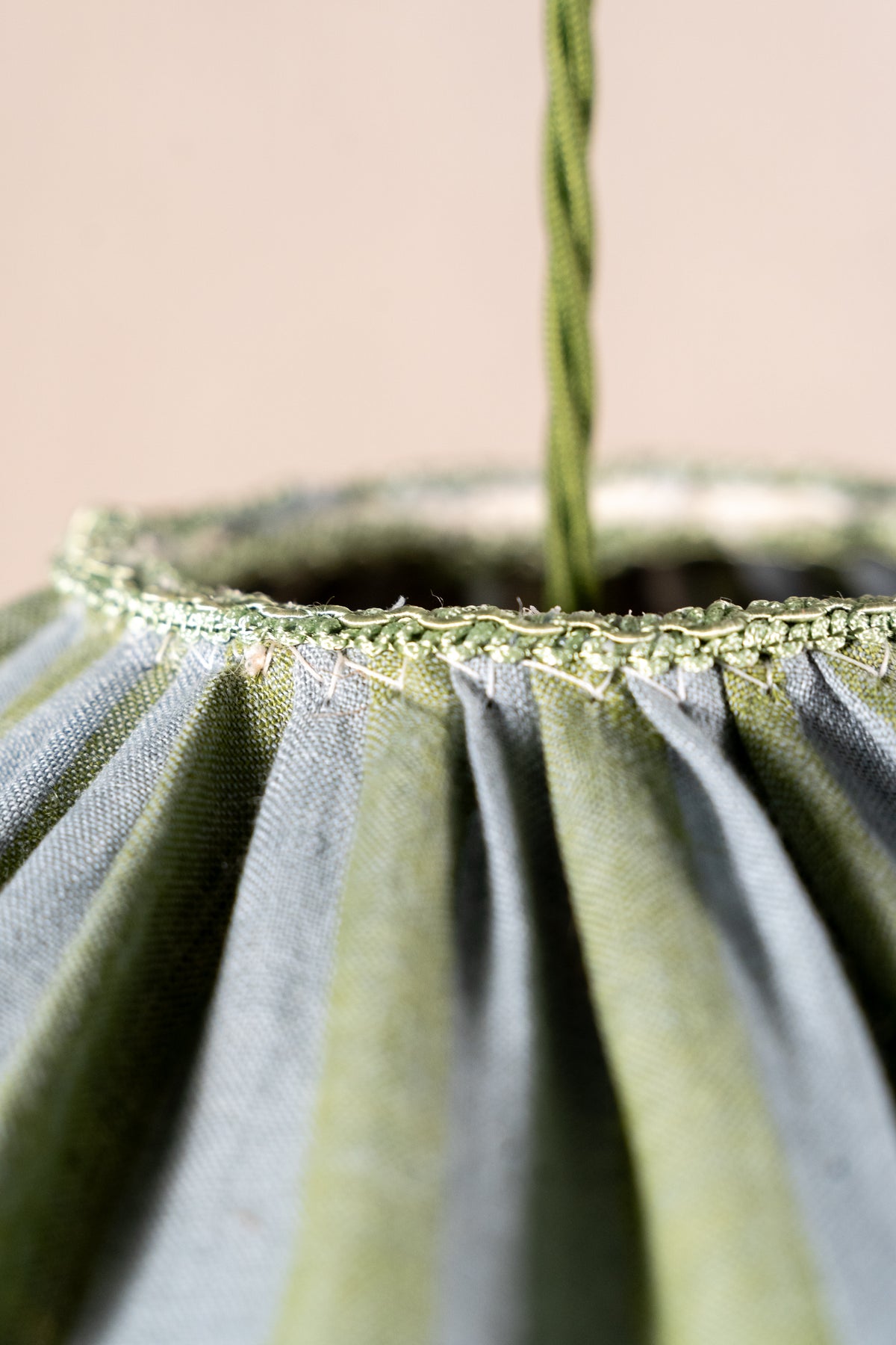 Handmade 12-inch linen carousel shade with sage green and soft blue stripes, vintage trim and pendant fitting. Cosy cottage style.
