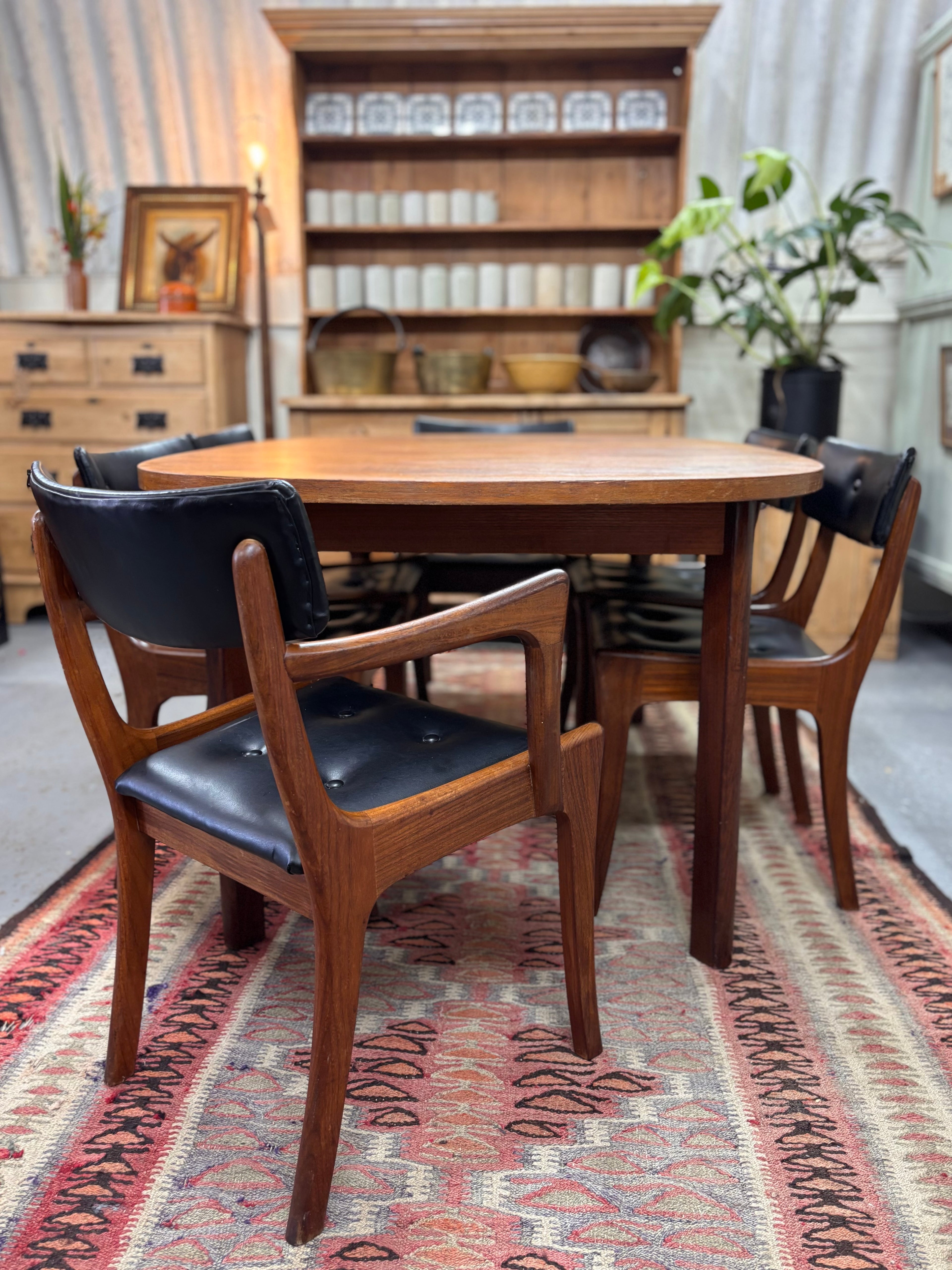 G Plan teak dining suite complete with an oval table and 6 sculptural chairs