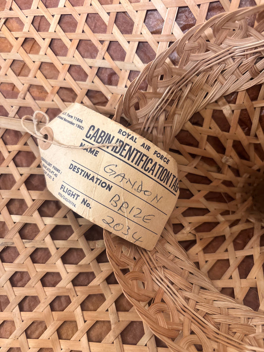 Vintage Asian conical hat with original Royal Air Force cabin identification tag attached, woven natural fibre hat with RAF Brize Norton luggage label.