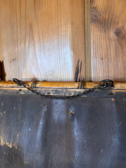 Back of a antique mirror with hanging chain