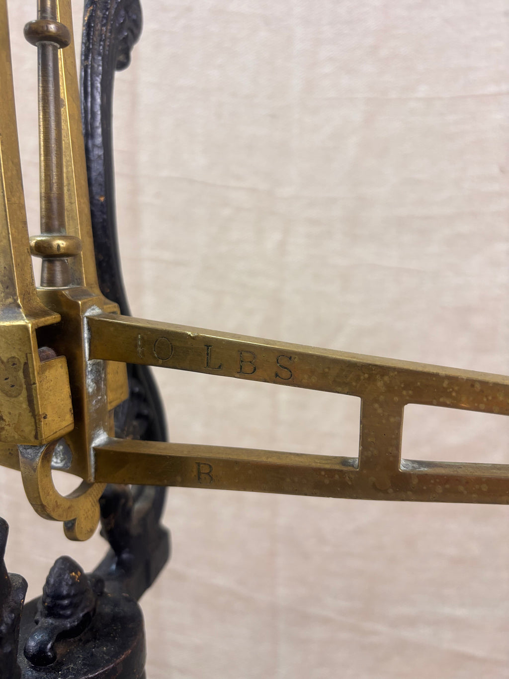 19th century W & T Avery Patent Agate Balance beam scale in brass and cast iron, photographed against a cream backdrop.