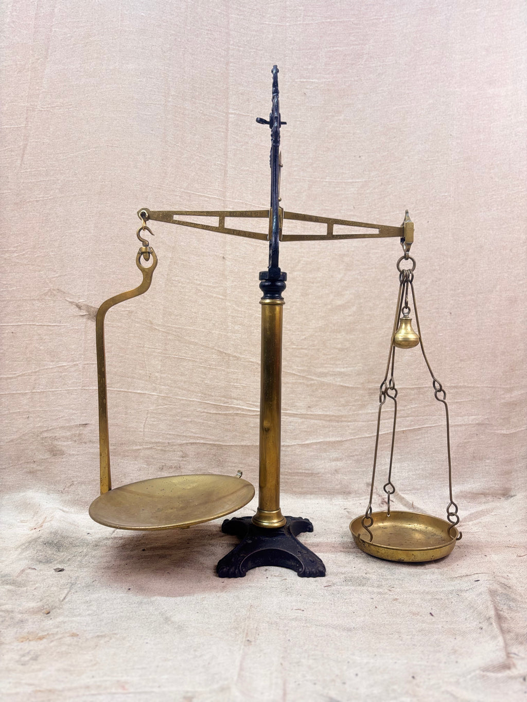 19th century W & T Avery Patent Agate Balance beam scale in brass and cast iron, photographed against a cream backdrop.
