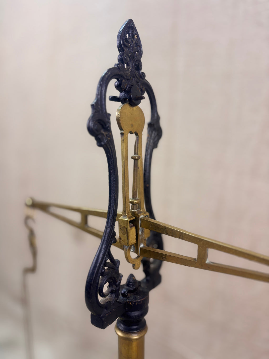 19th century W & T Avery Patent Agate Balance beam scale in brass and cast iron, photographed against a cream backdrop.