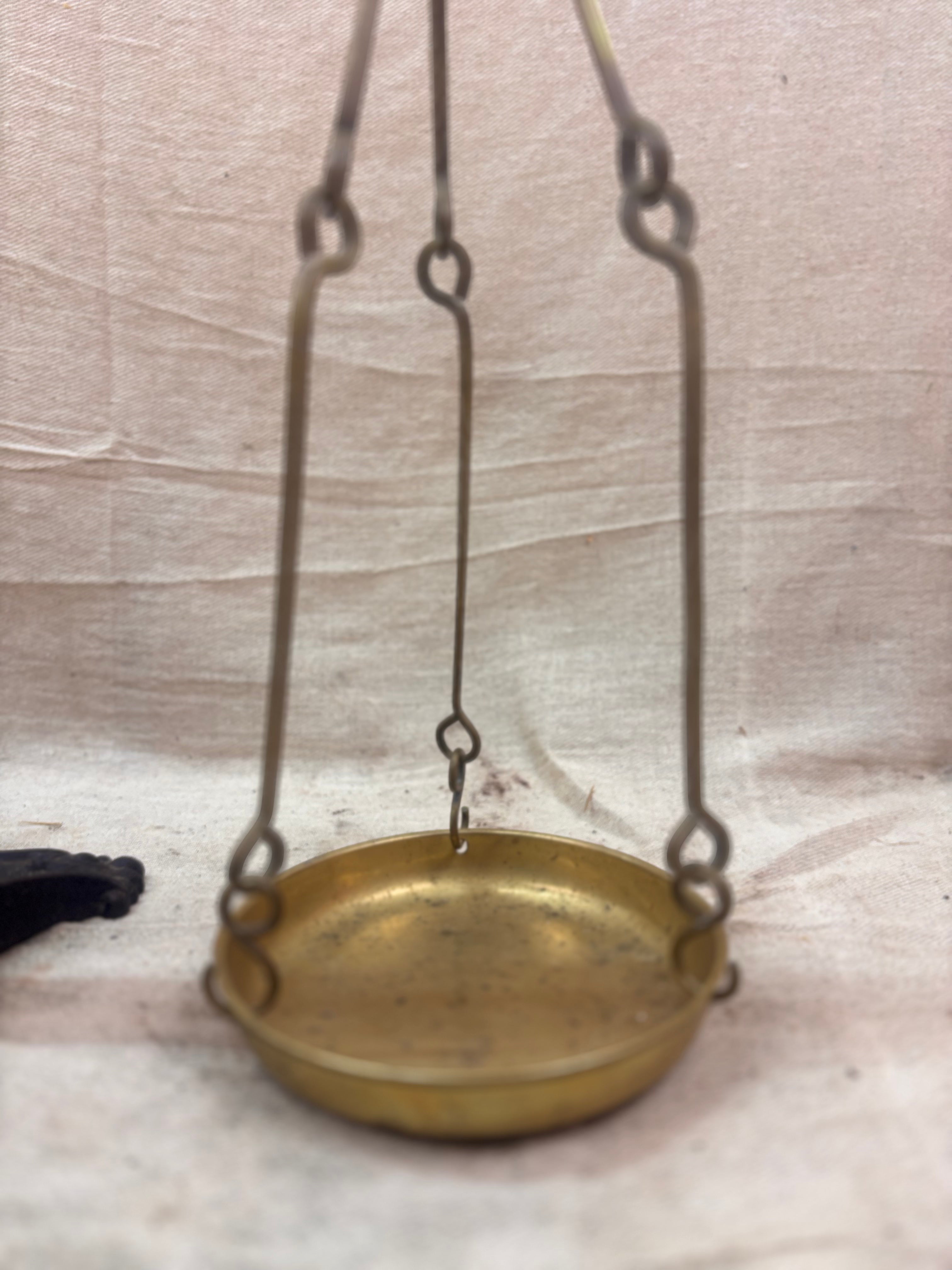 19th century W & T Avery Patent Agate Balance beam scale in brass and cast iron, photographed against a cream backdrop.