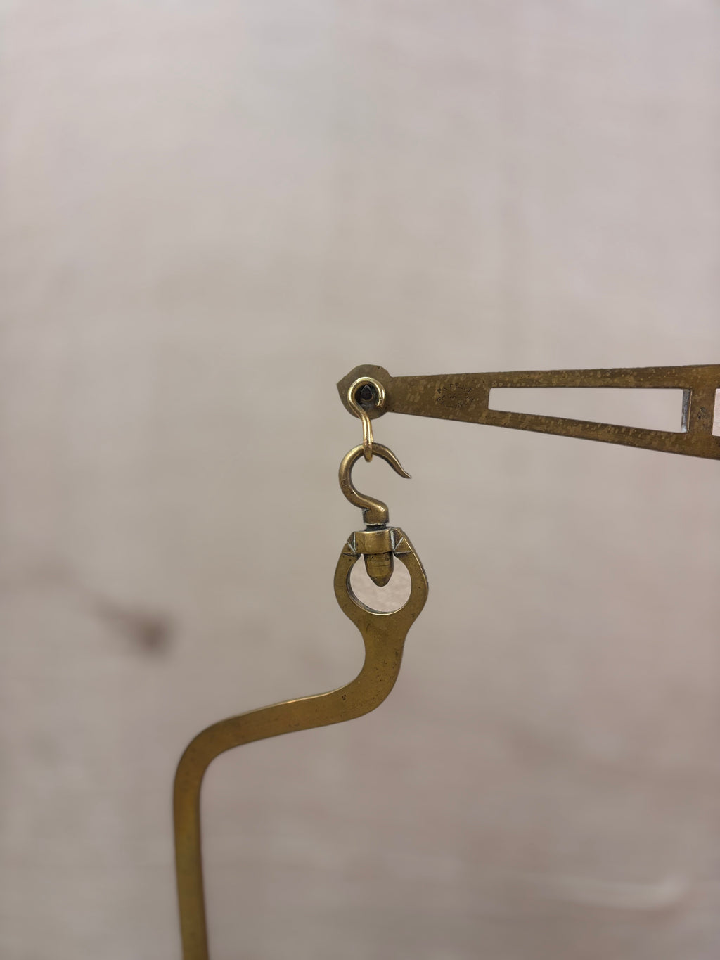 19th century W & T Avery Patent Agate Balance beam scale in brass and cast iron, photographed against a cream backdrop.