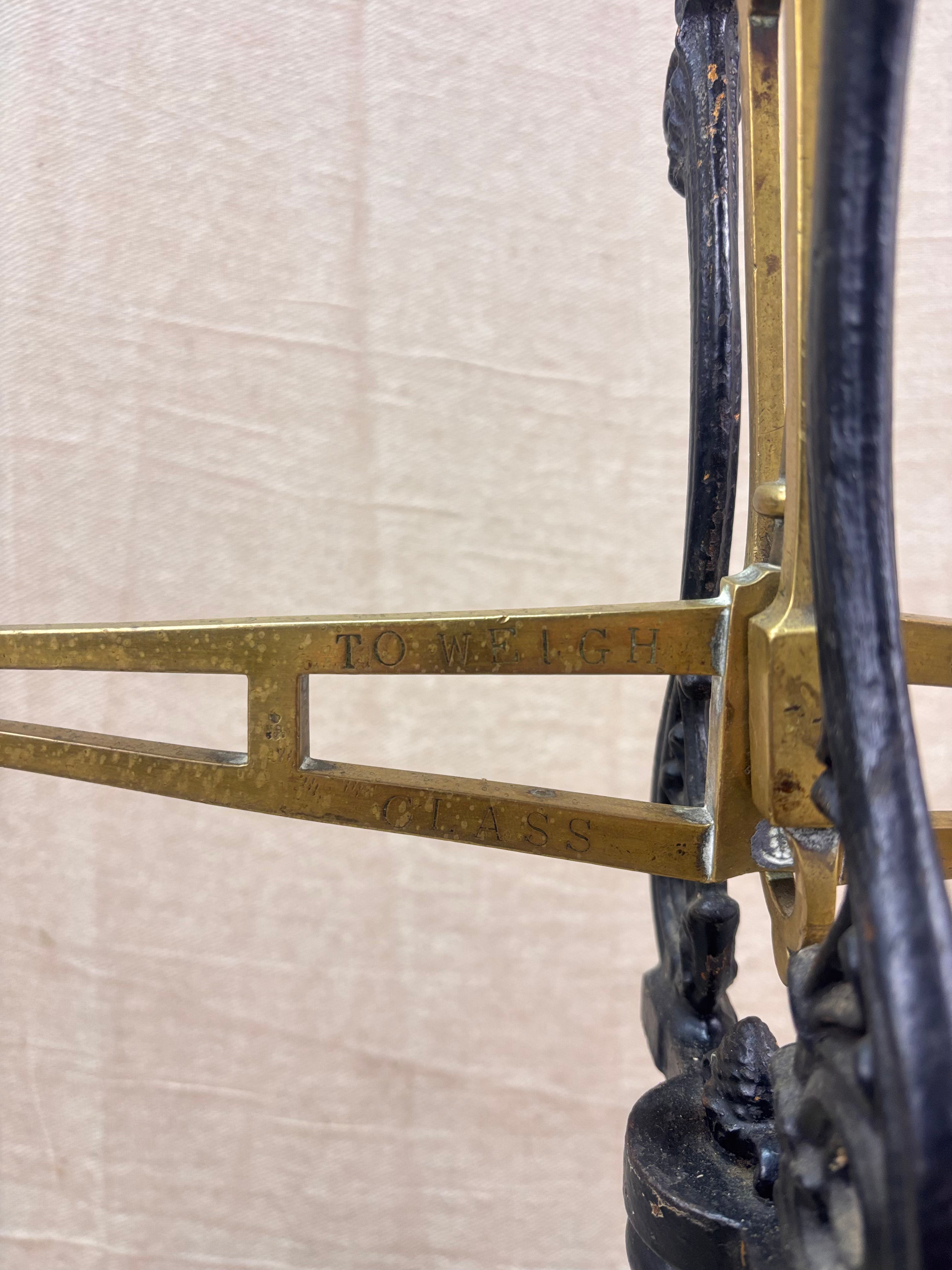 19th century W & T Avery Patent Agate Balance beam scale in brass and cast iron, photographed against a cream backdrop.