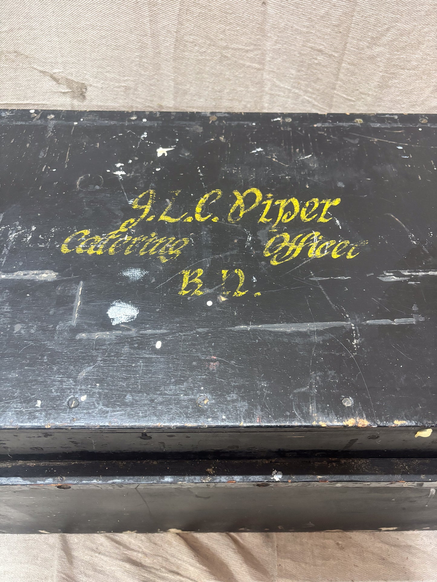 Black box with gold text on a light gray background