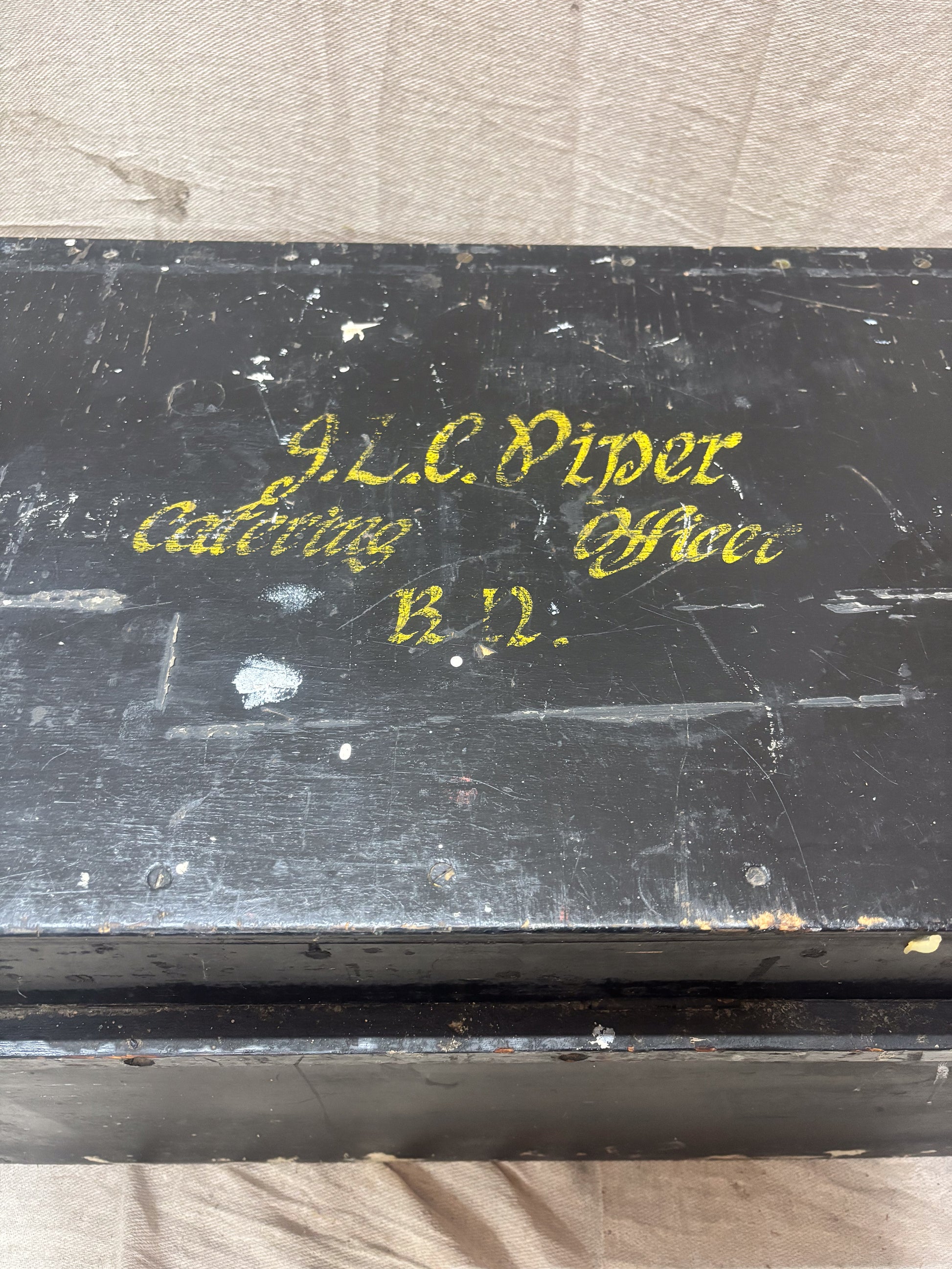Black box with gold text on a light gray background
