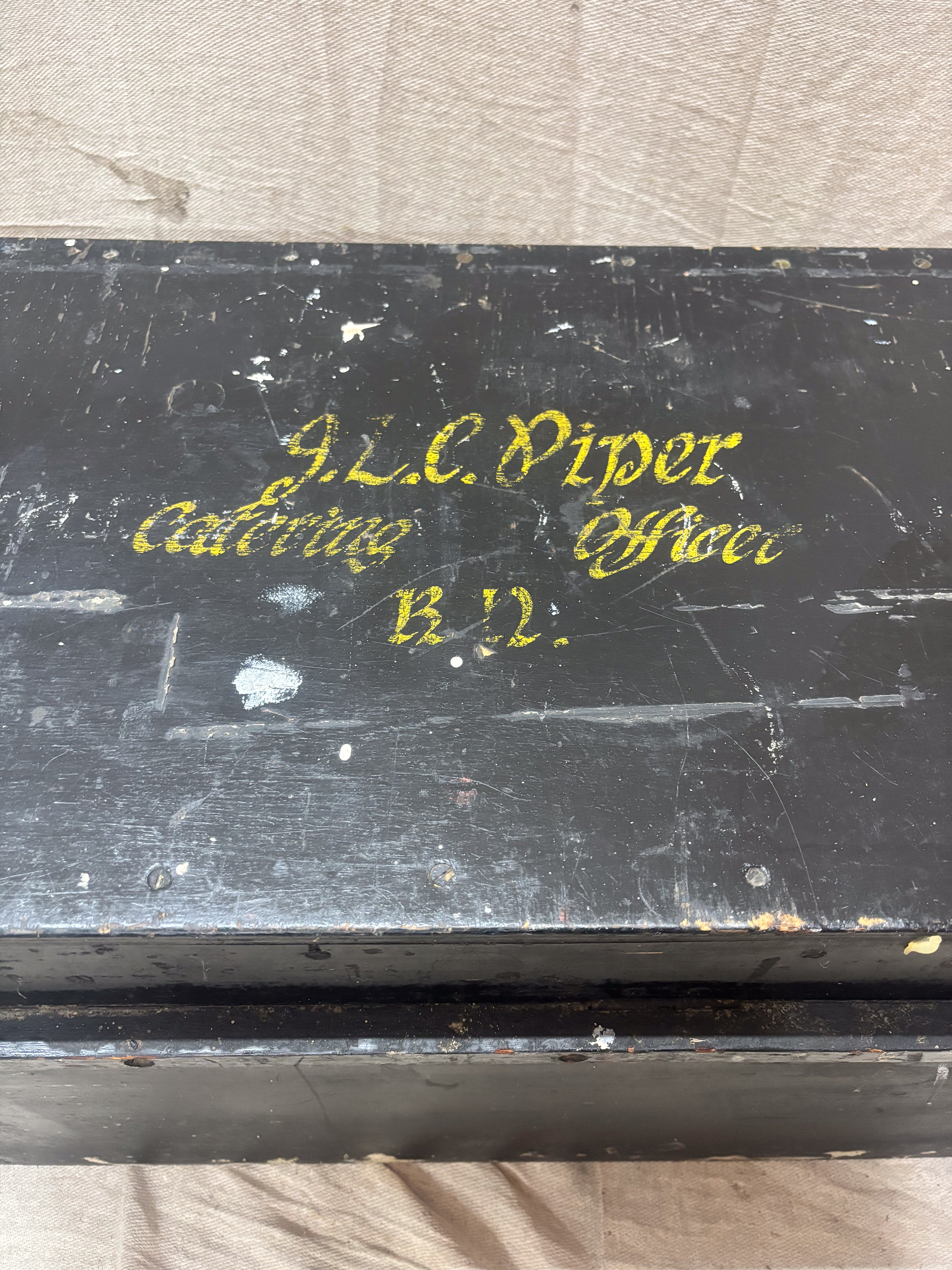 Black box with gold text on a light gray background