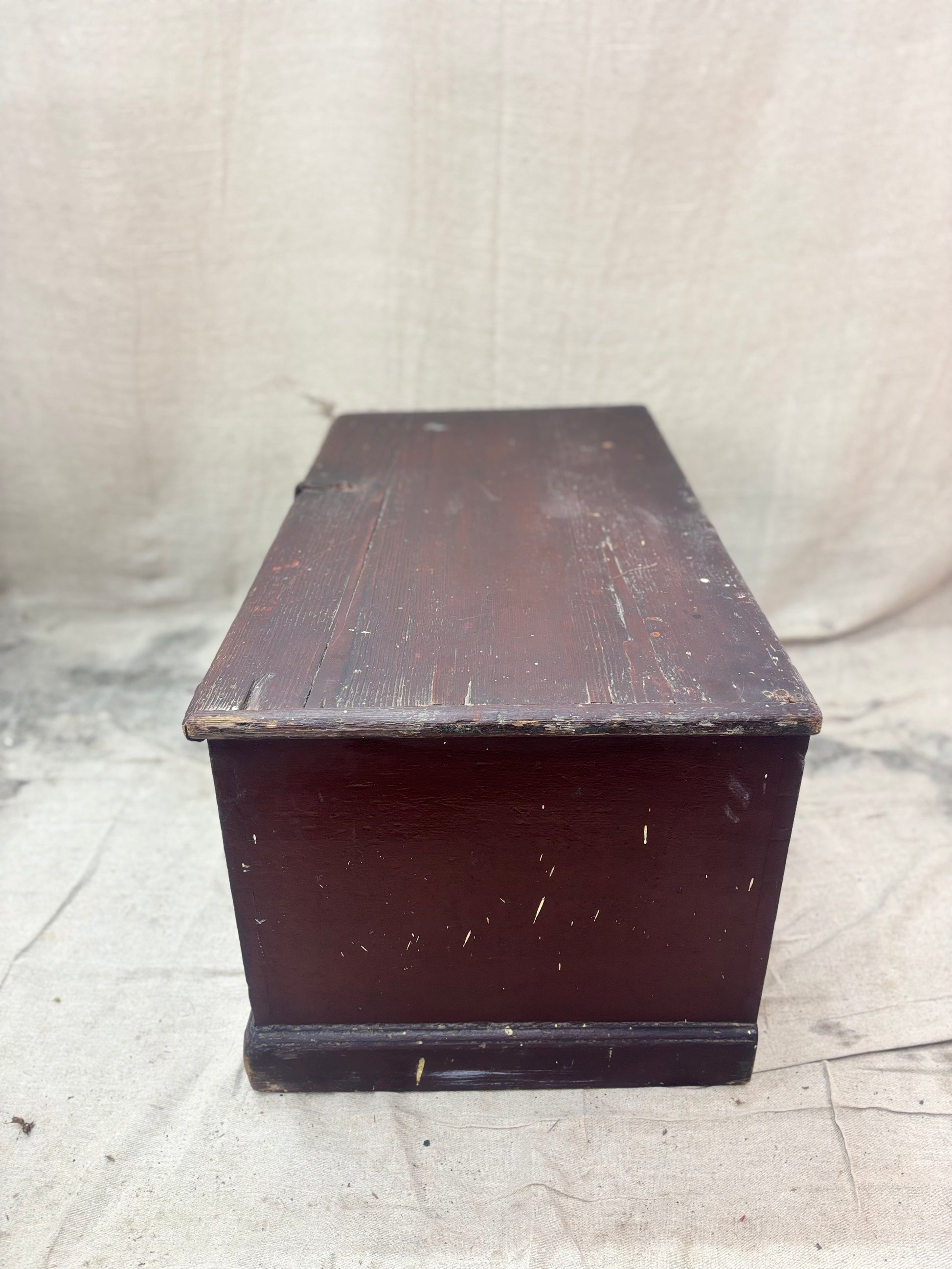 Antique wooden trunk on a textured white background