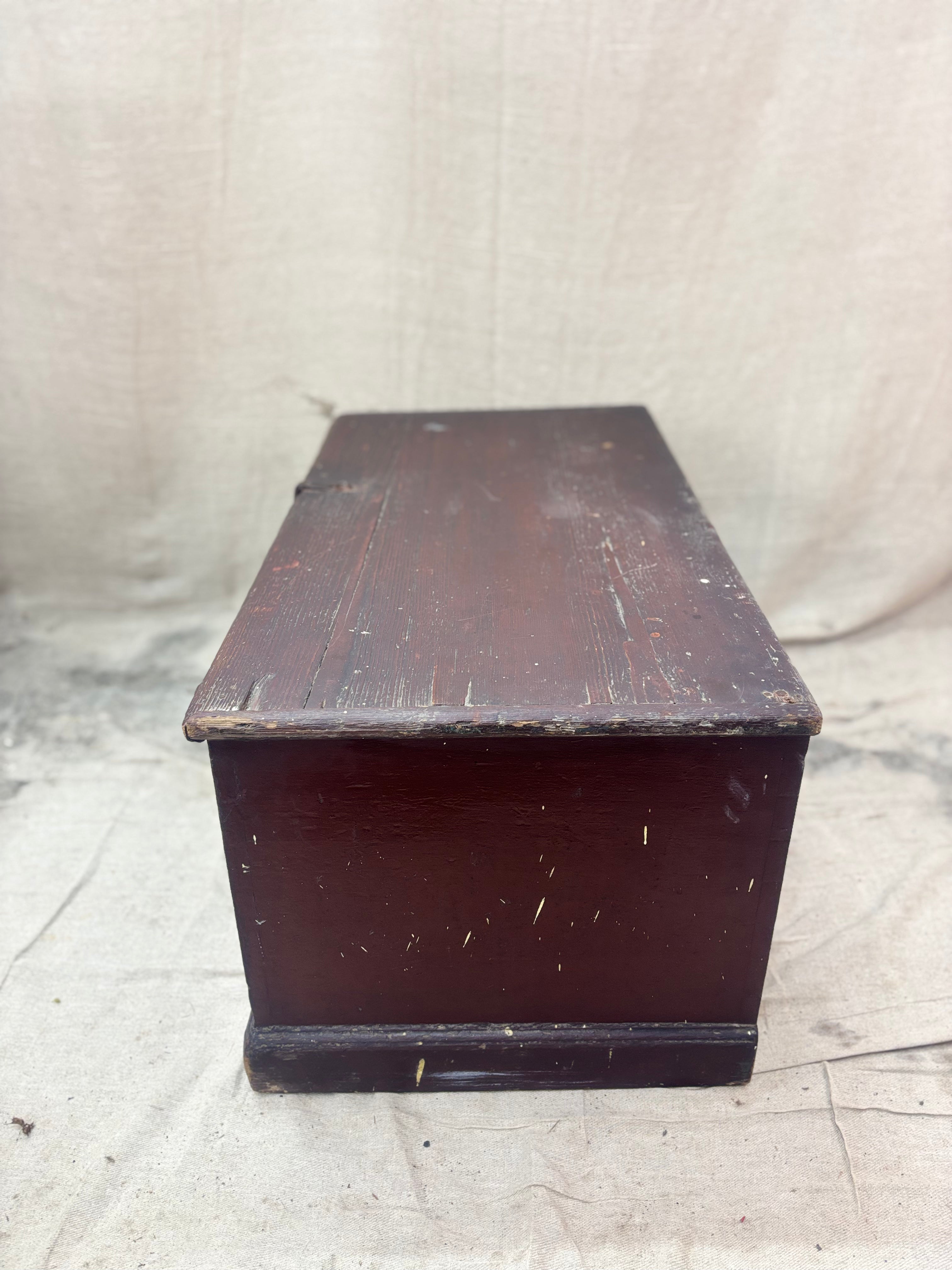 Antique wooden trunk on a textured white background