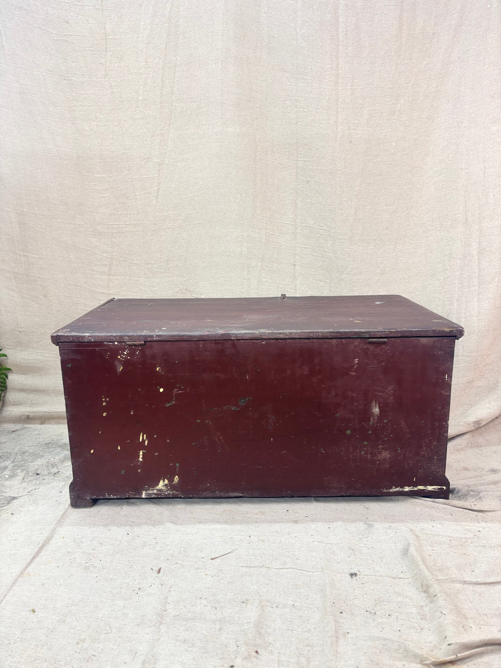 Antique wooden trunk on a textured white background