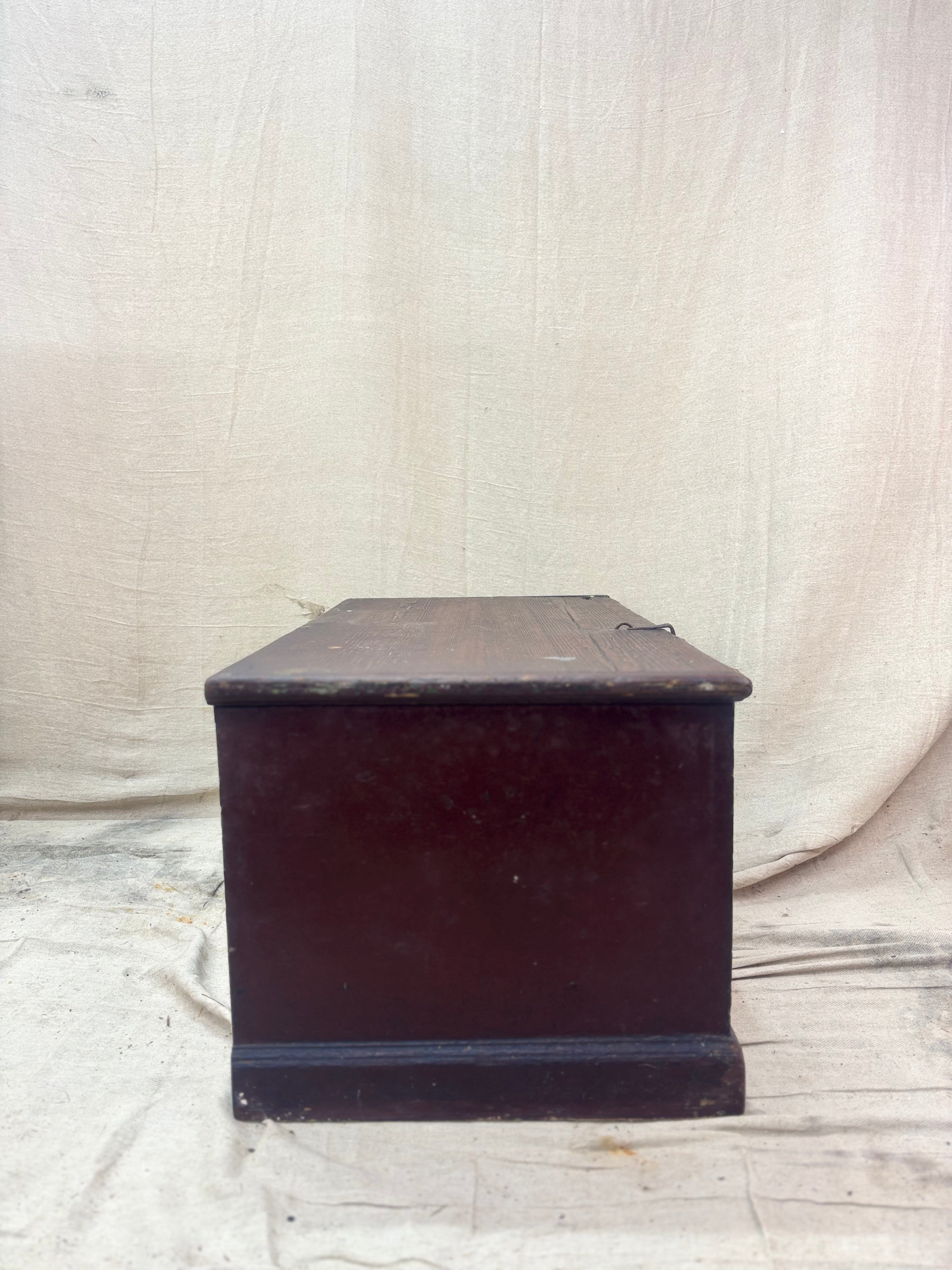 Antique wooden trunk on a textured white background