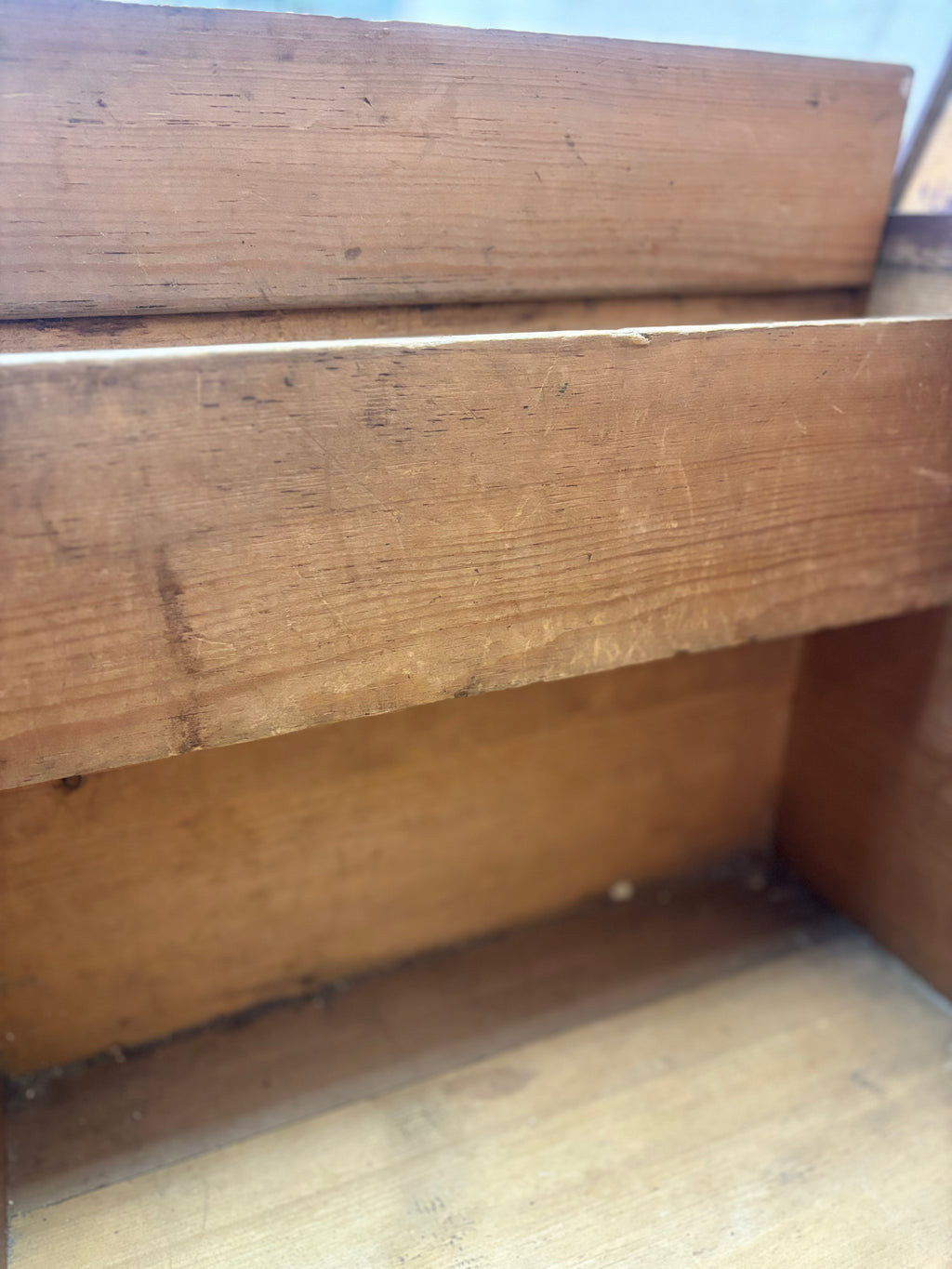 Close-up of a wooden box with visible grain and texture