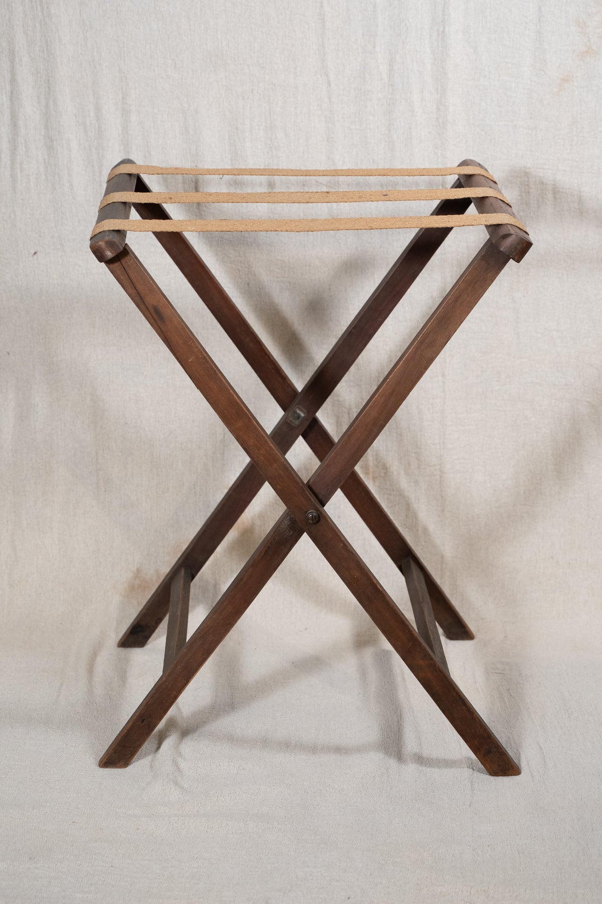 Classic wooden butler's tray with raised gallery, pierced carrying handles and folding X-frame stand. A versatile serving and occasional table.