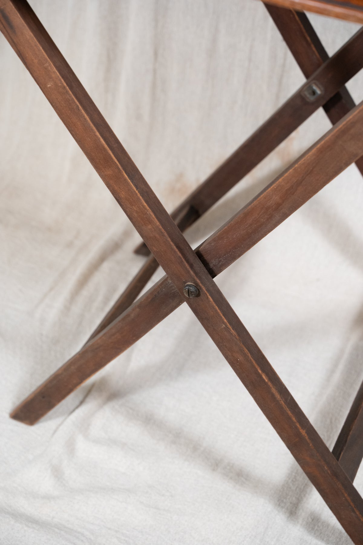 Classic wooden butler's tray with raised gallery, pierced carrying handles and folding X-frame stand. A versatile serving and occasional table.