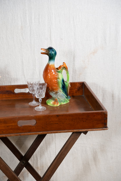 Classic wooden butler's tray with raised gallery, pierced carrying handles and folding X-frame stand. A versatile serving and occasional table.