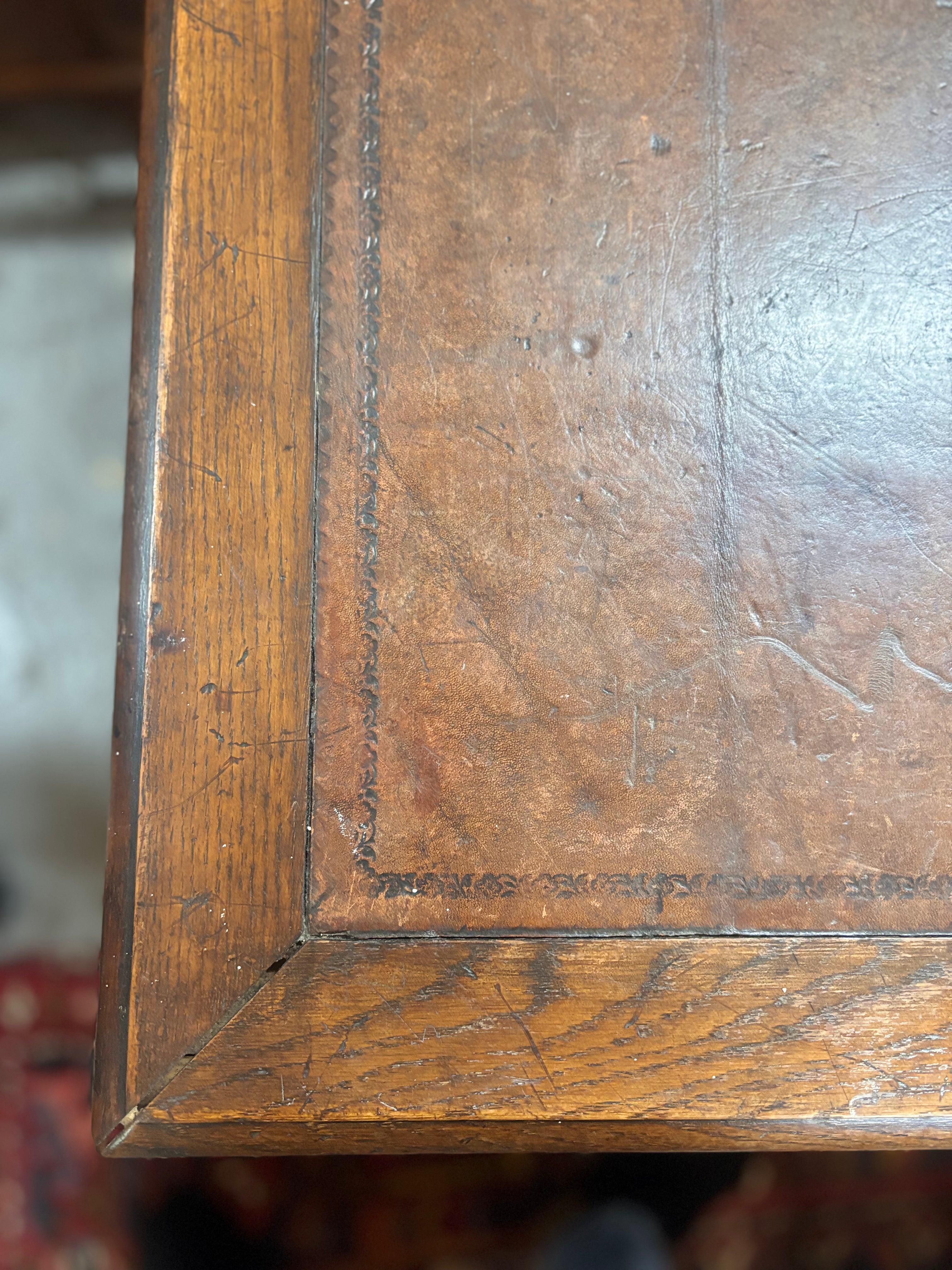 Close-up of a leather writing surface with visible grain and texture