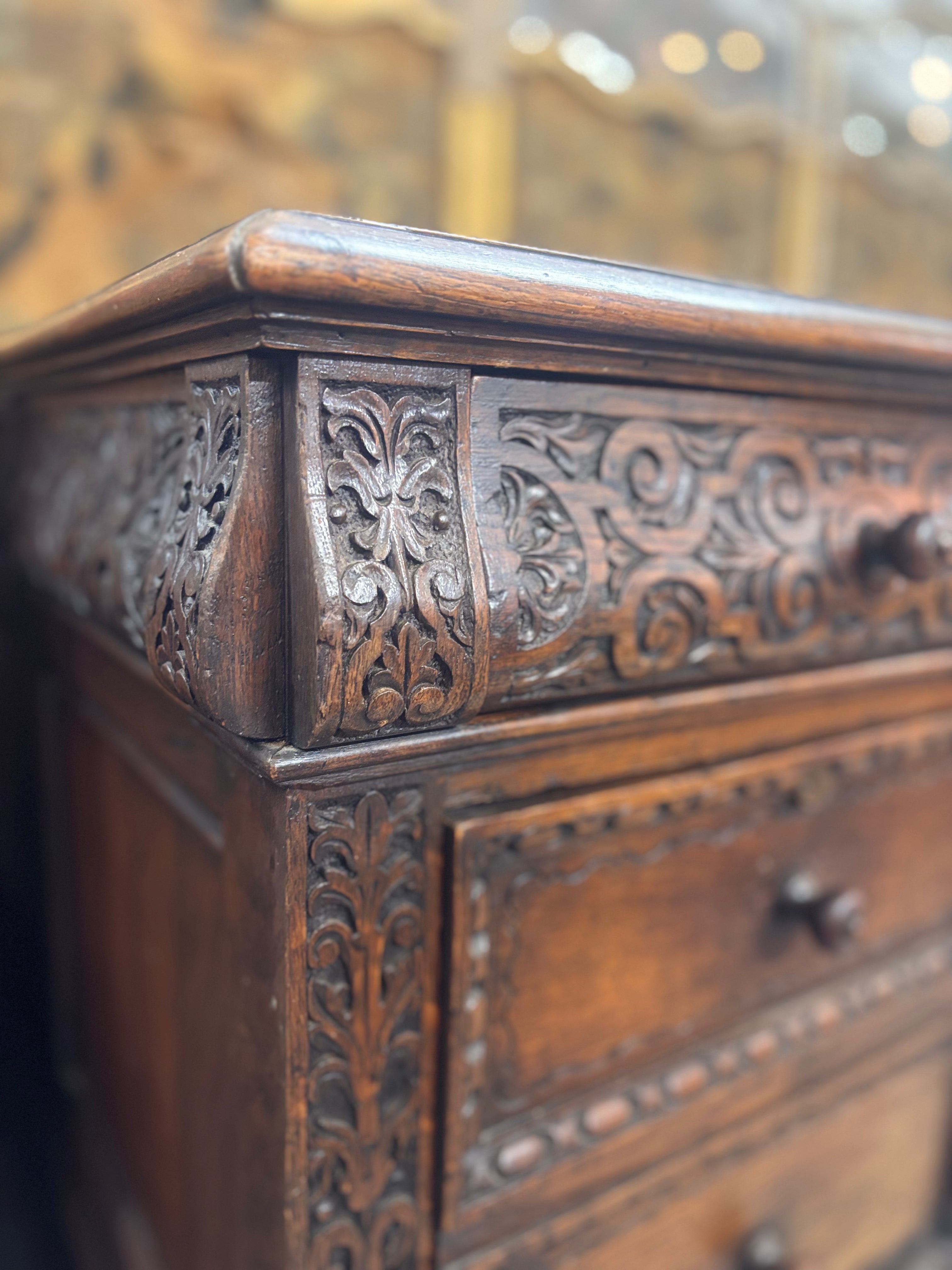 Close-up of an intricately carved wooden cabinet with detailed patterns.