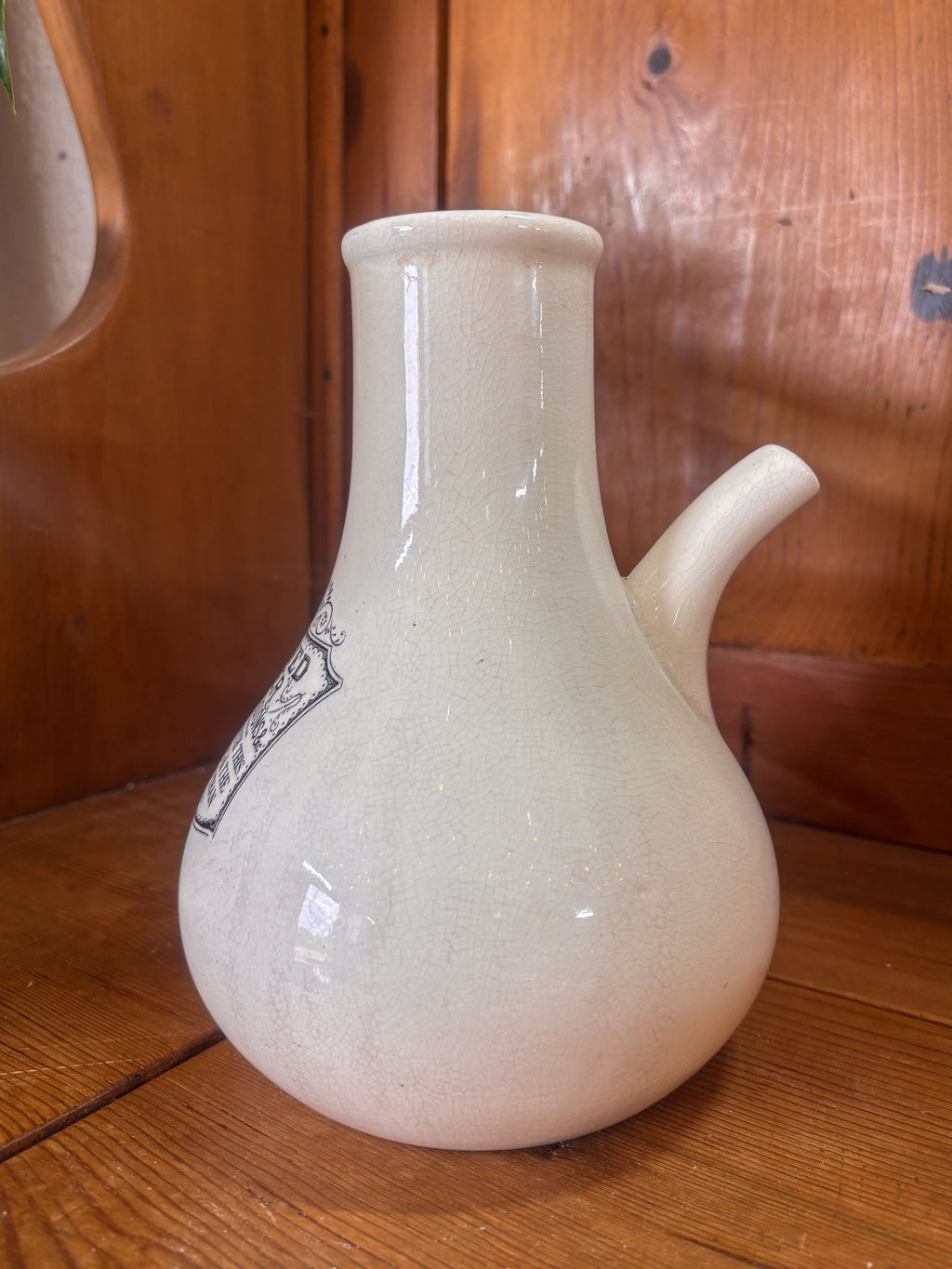 White ceramic inhaler on a wooden surface with a wooden background