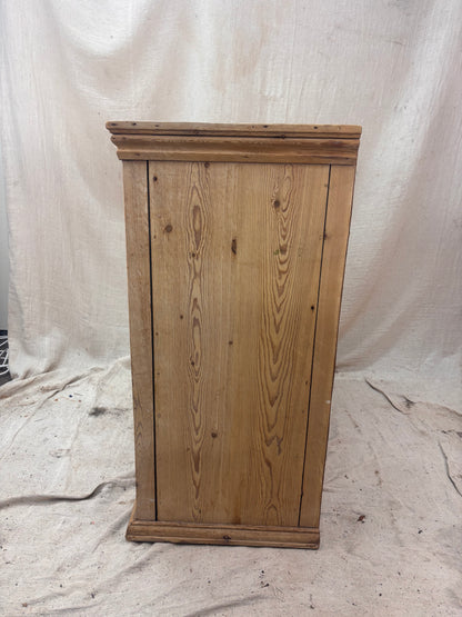 Wooden cabinet on a white fabric background