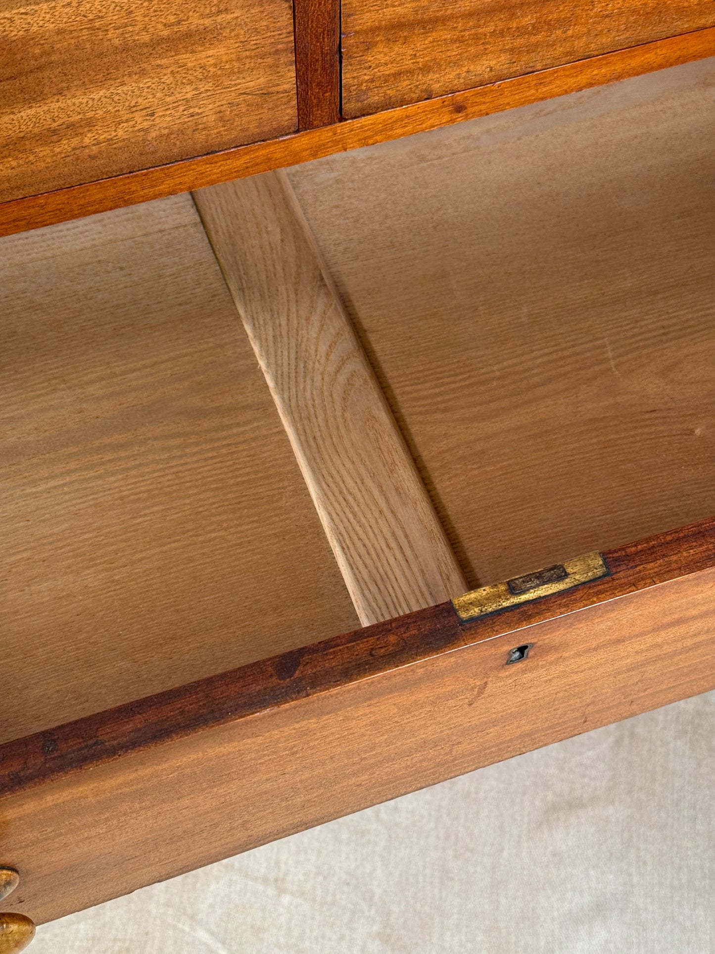 Close-up of a wooden door with a hinge