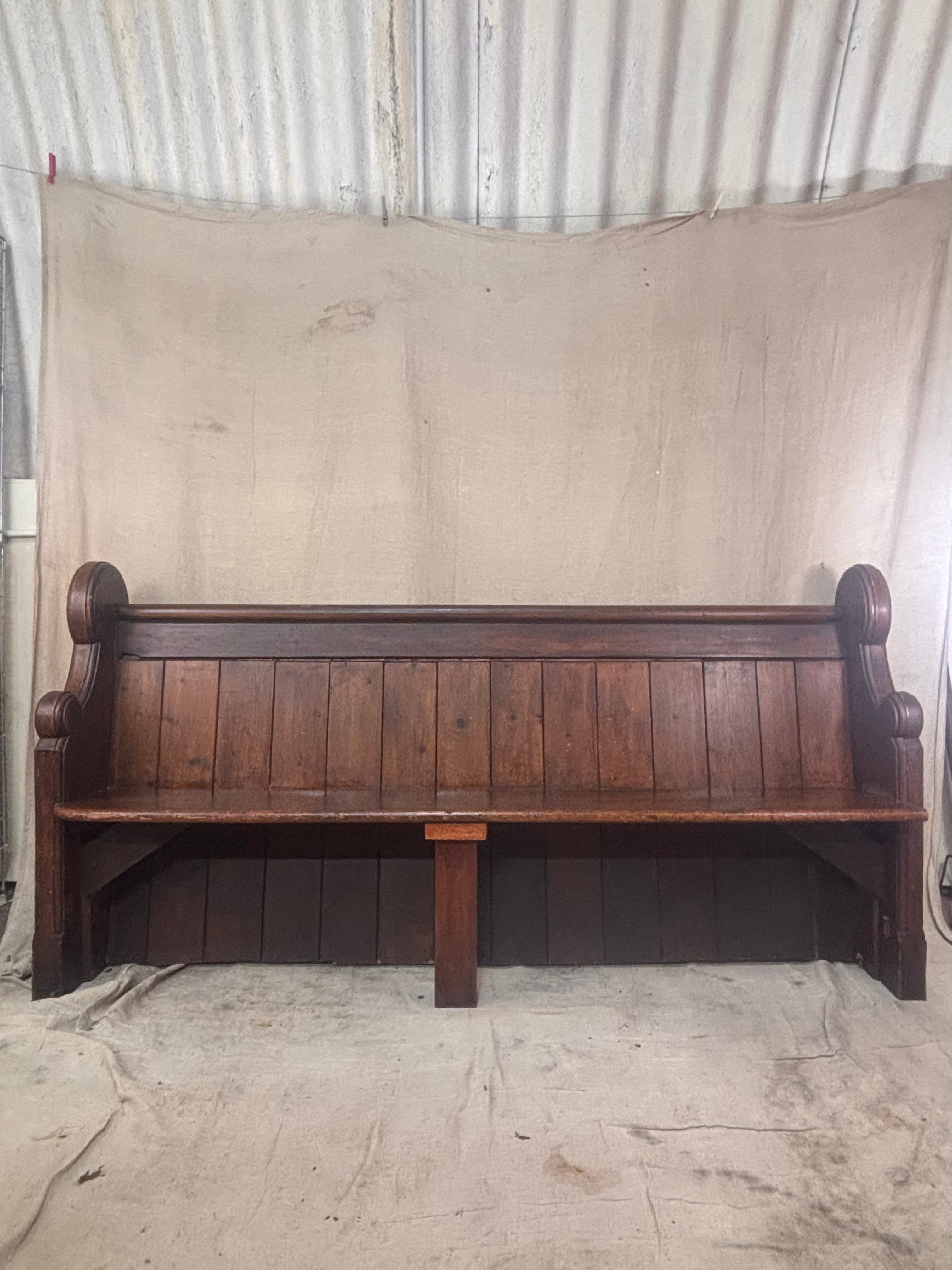 Wooden bench against a plain background