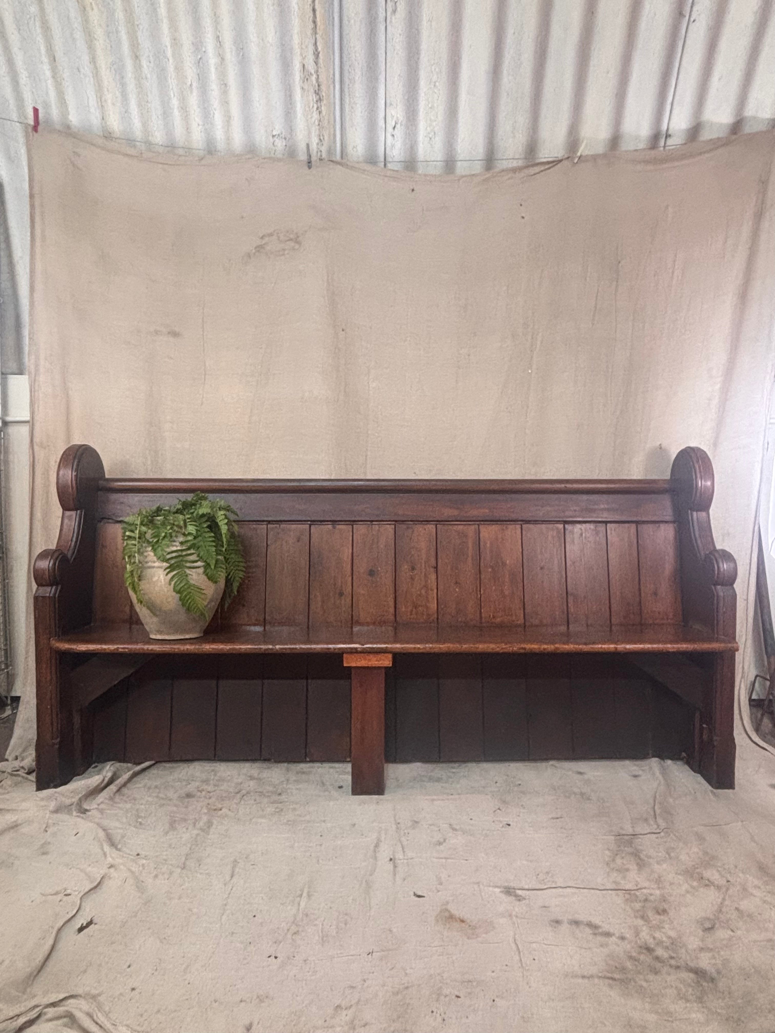 Wooden bench with a plant on a rustic background