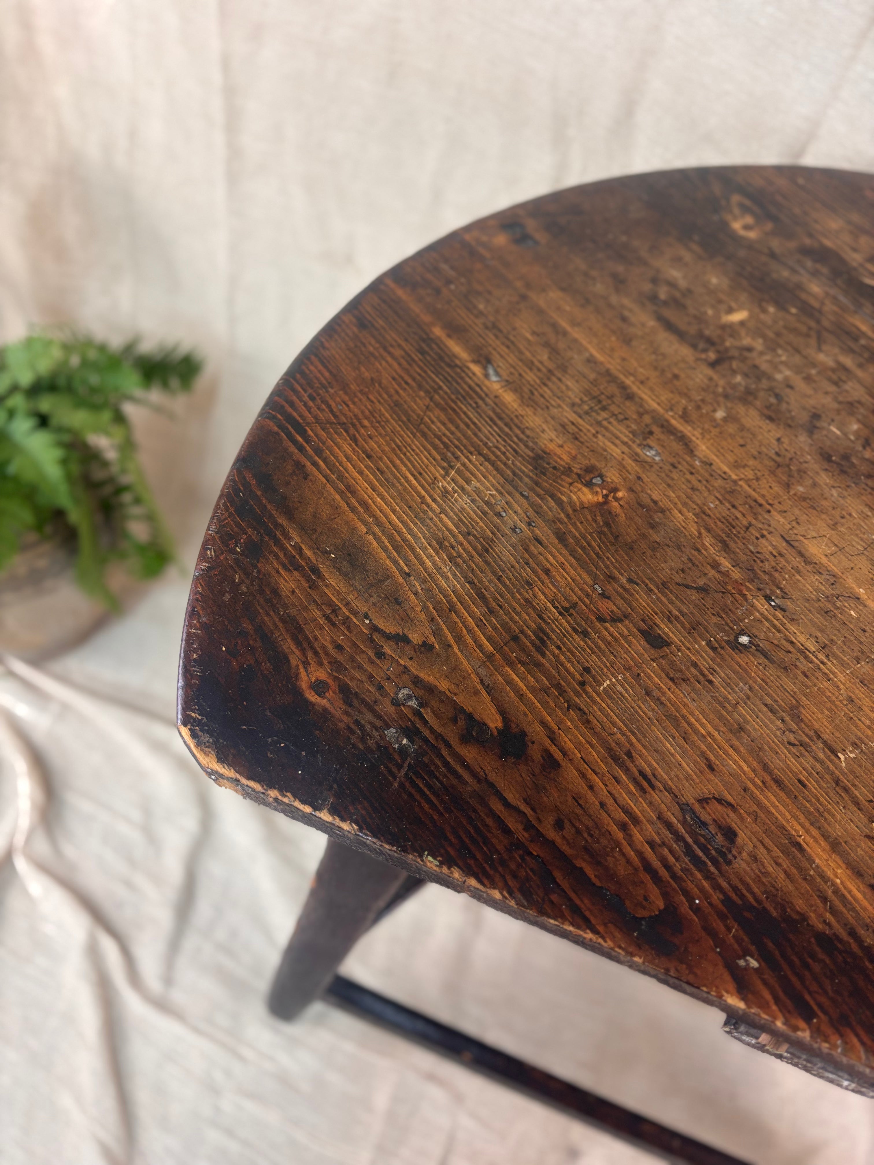 Wooden table with a worn finish on a light background