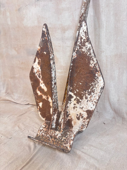 Vintage Danforth style ship anchor with folding flukes, original worn paint and surface rust. A nautical display piece for coastal interiors or garden settings.