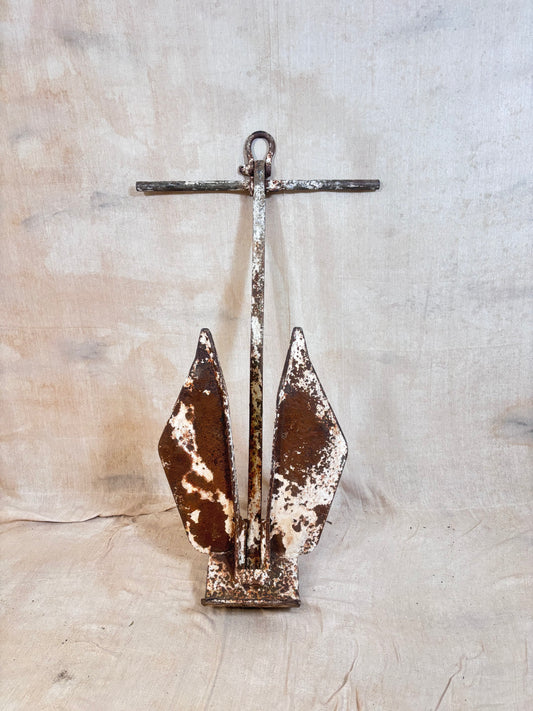 Vintage Danforth style ship anchor with folding flukes, original worn paint and surface rust. A nautical display piece for coastal interiors or garden settings.