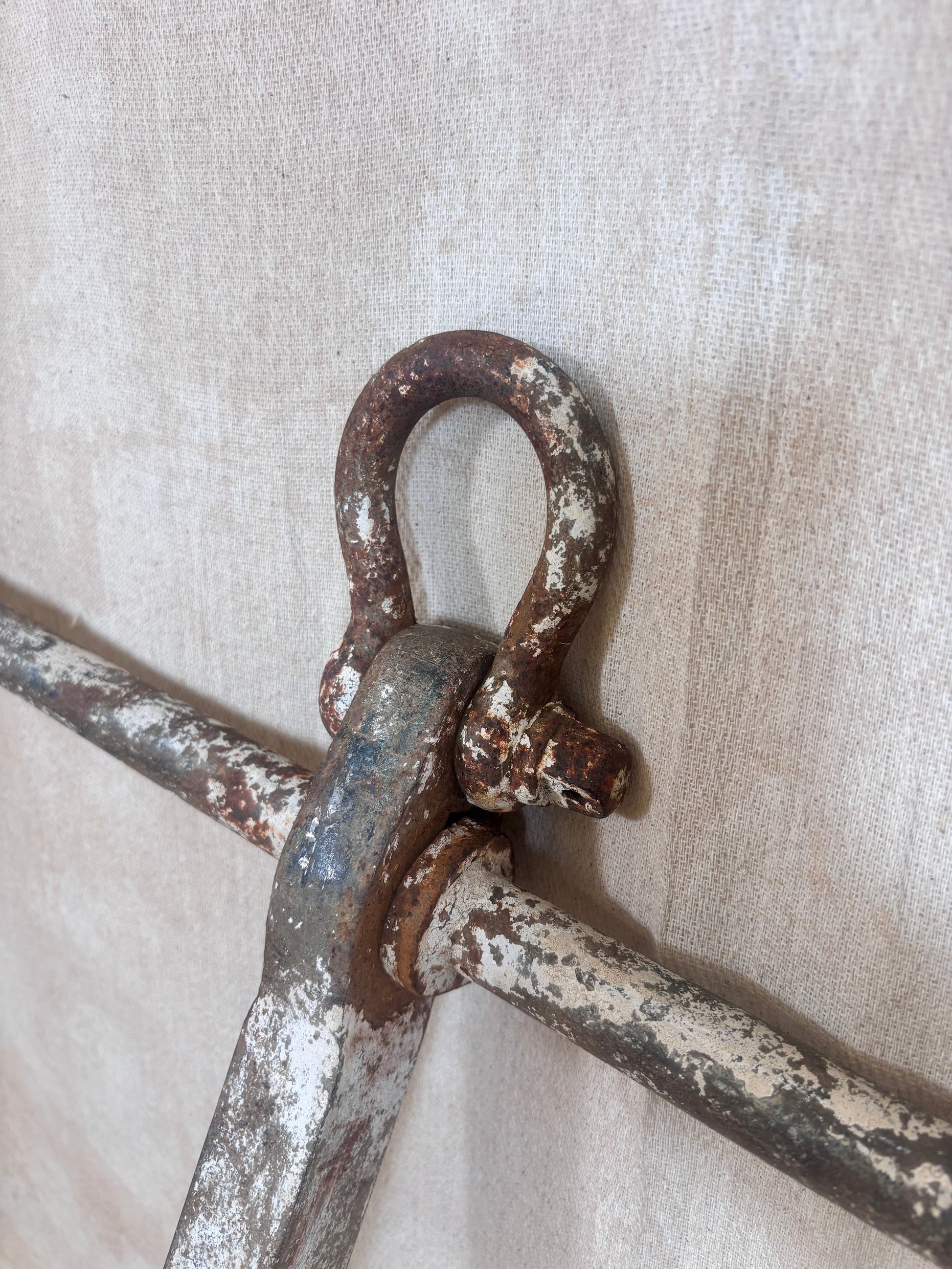 Vintage Danforth style ship anchor with folding flukes, original worn paint and surface rust. A nautical display piece for coastal interiors or garden settings.