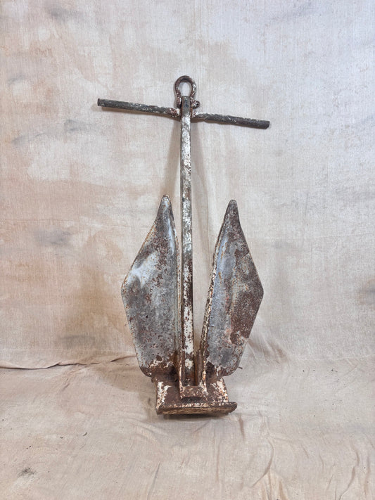 Vintage Danforth style ship anchor with folding flukes, original worn paint and surface rust. A nautical display piece for coastal interiors or garden settings.