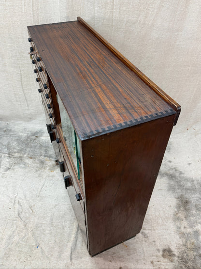 Wooden cabinet with a textured surface on a light gray background