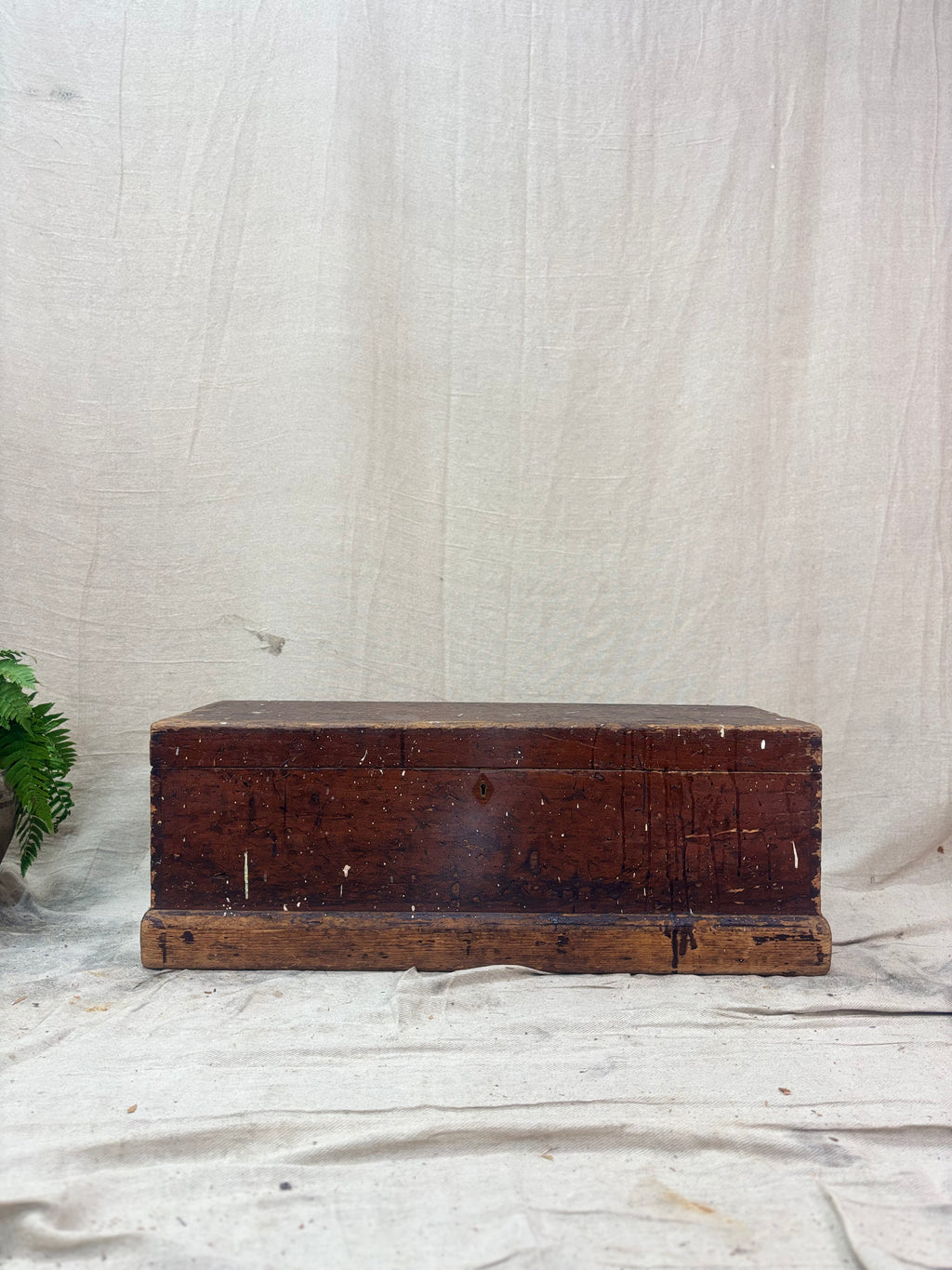 Vintage wooden trunk on a textured white background