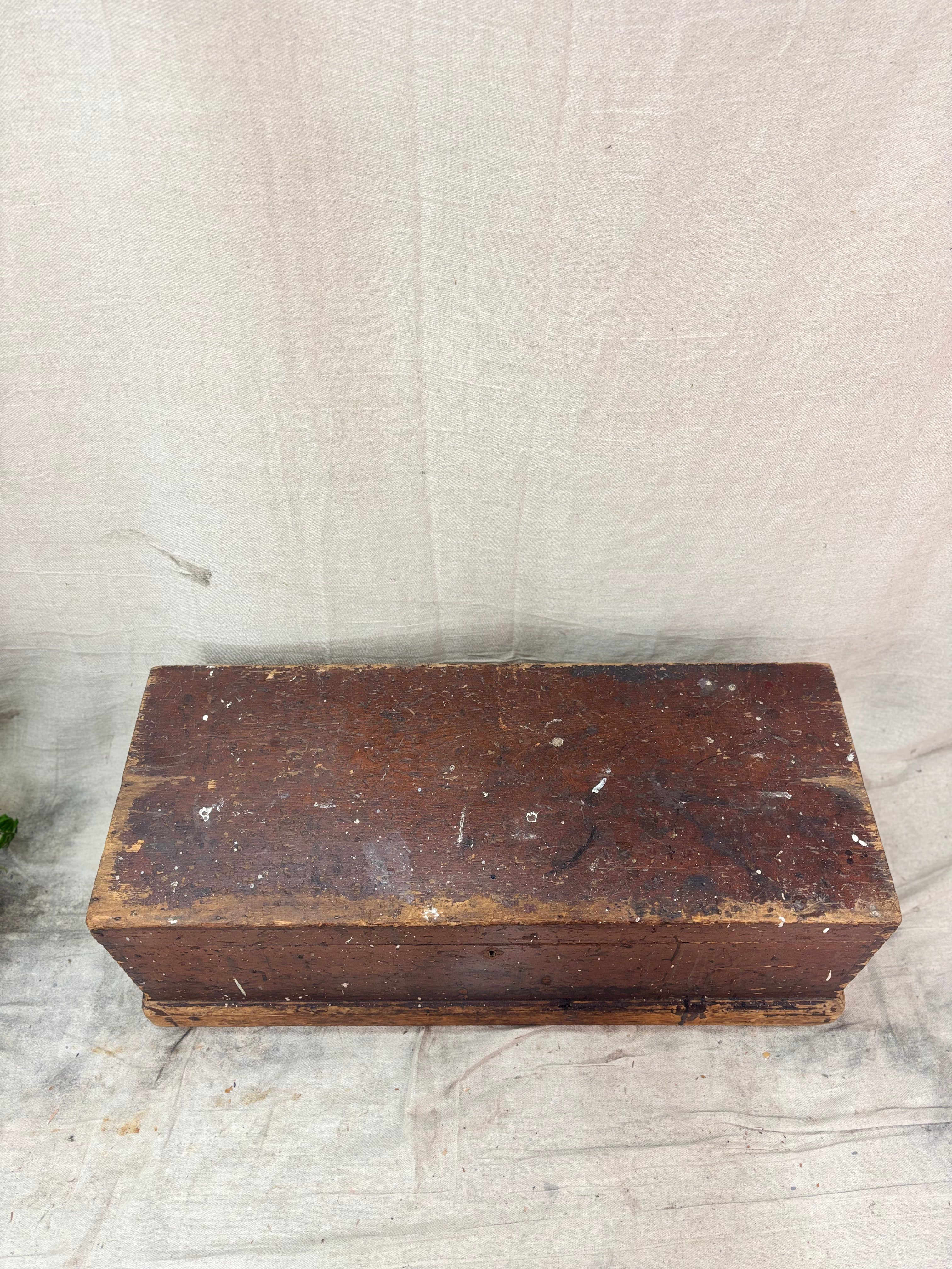 Vintage wooden box on a textured beige background