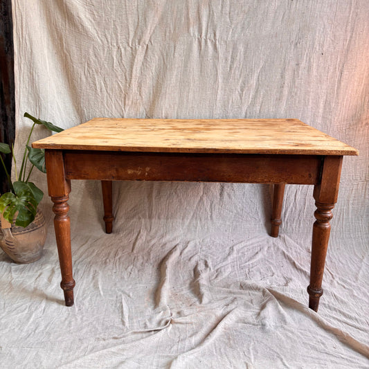 Wooden table on a textured white fabric background