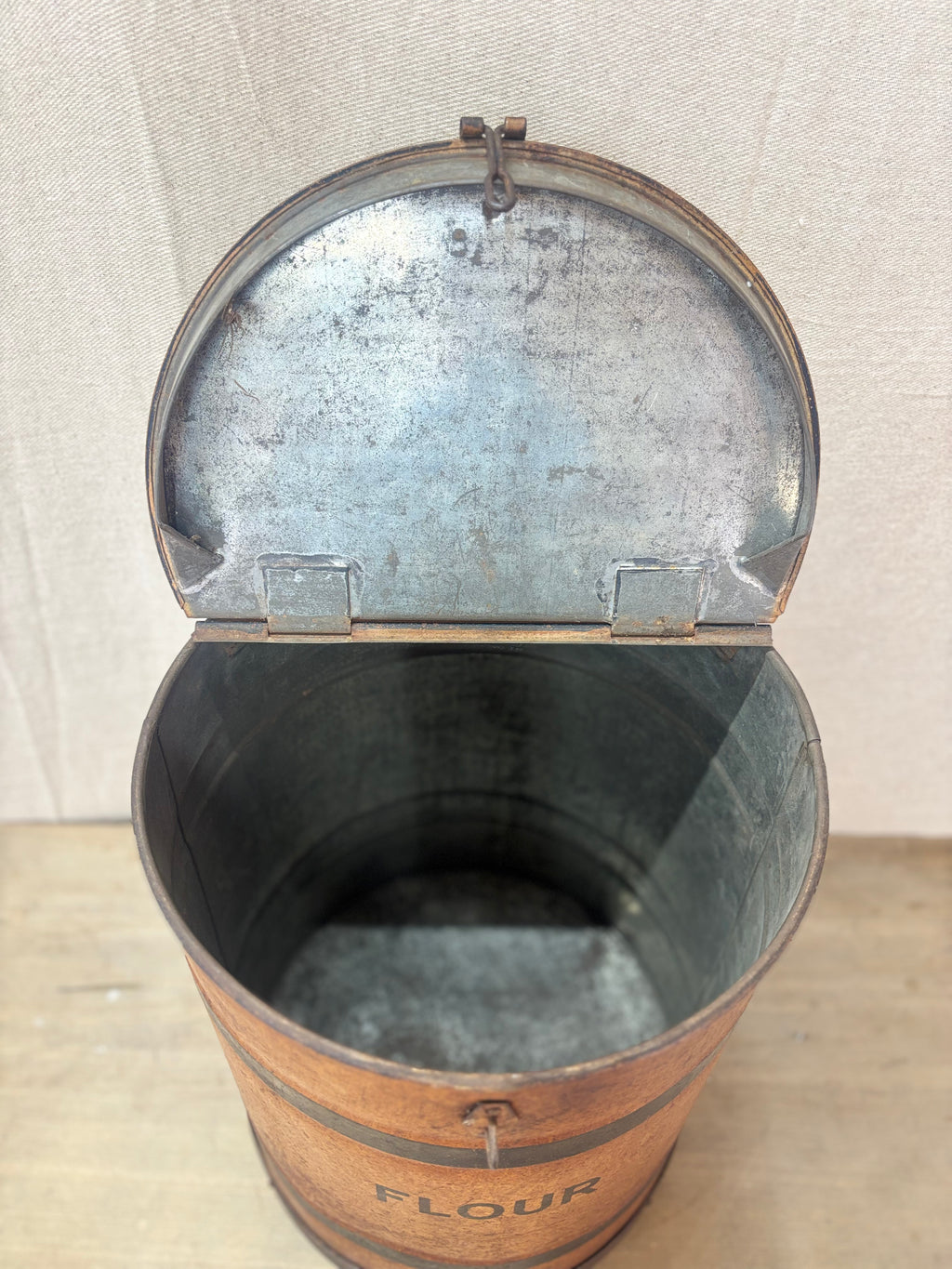 An open antique Tin Flour Bin on a plain background. 
