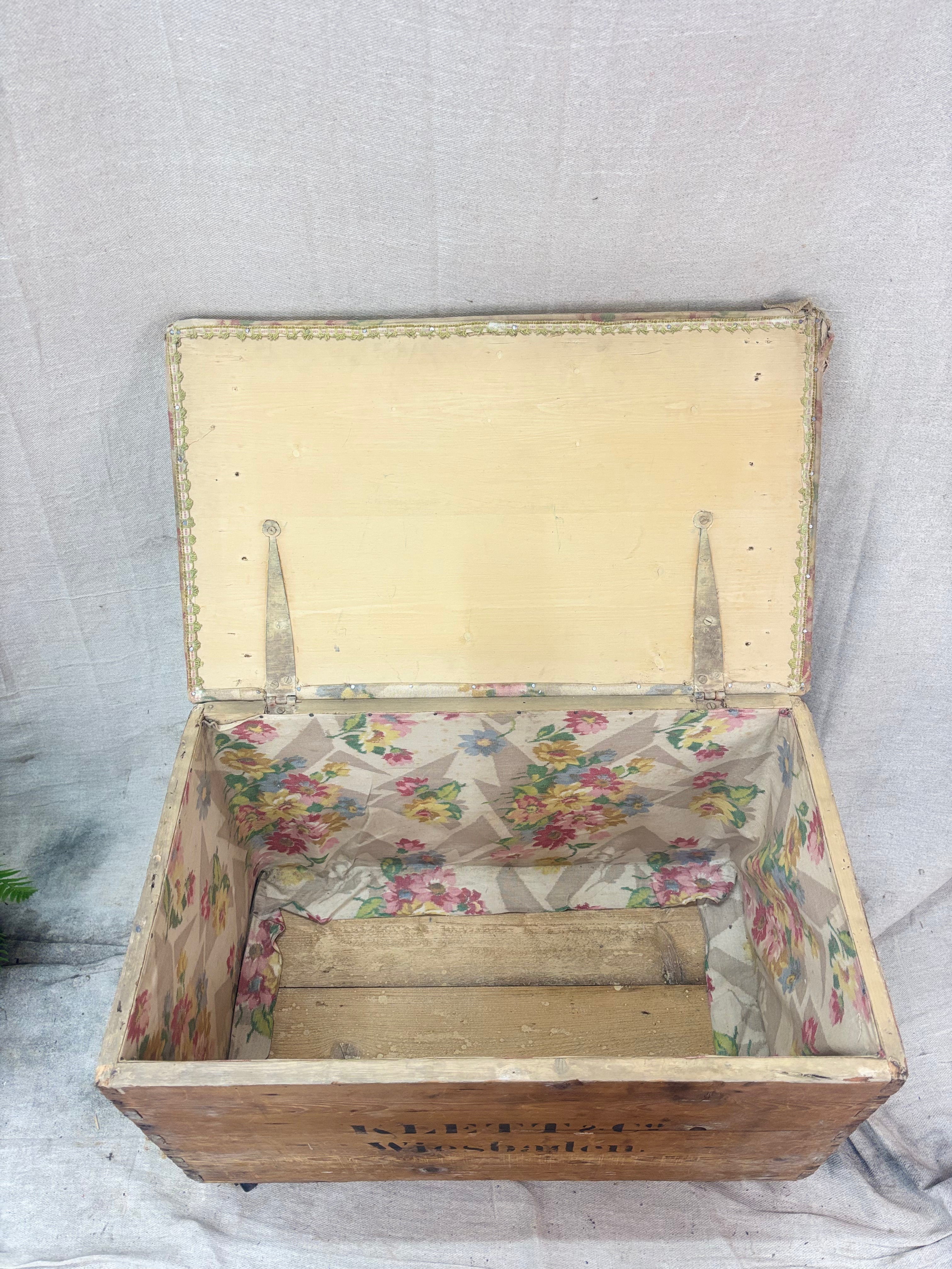 Wooden box with floral interior on a textured gray background