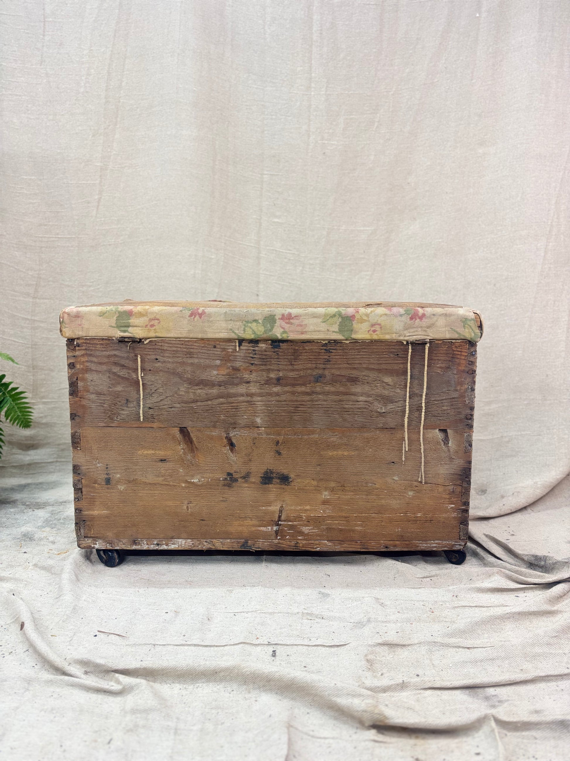 Vintage wooden trunk with floral pattern on a plain background