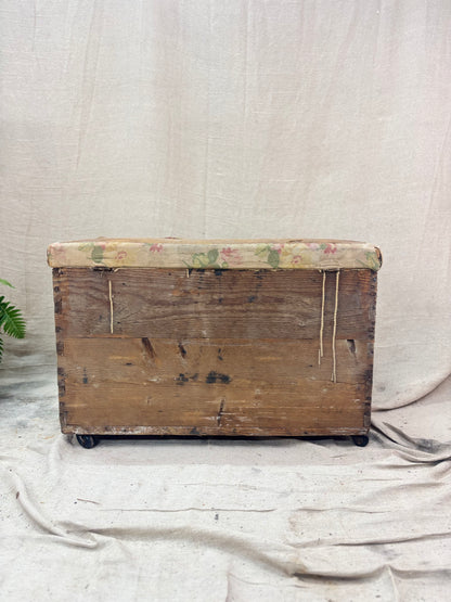 Vintage wooden trunk with floral pattern on a plain background