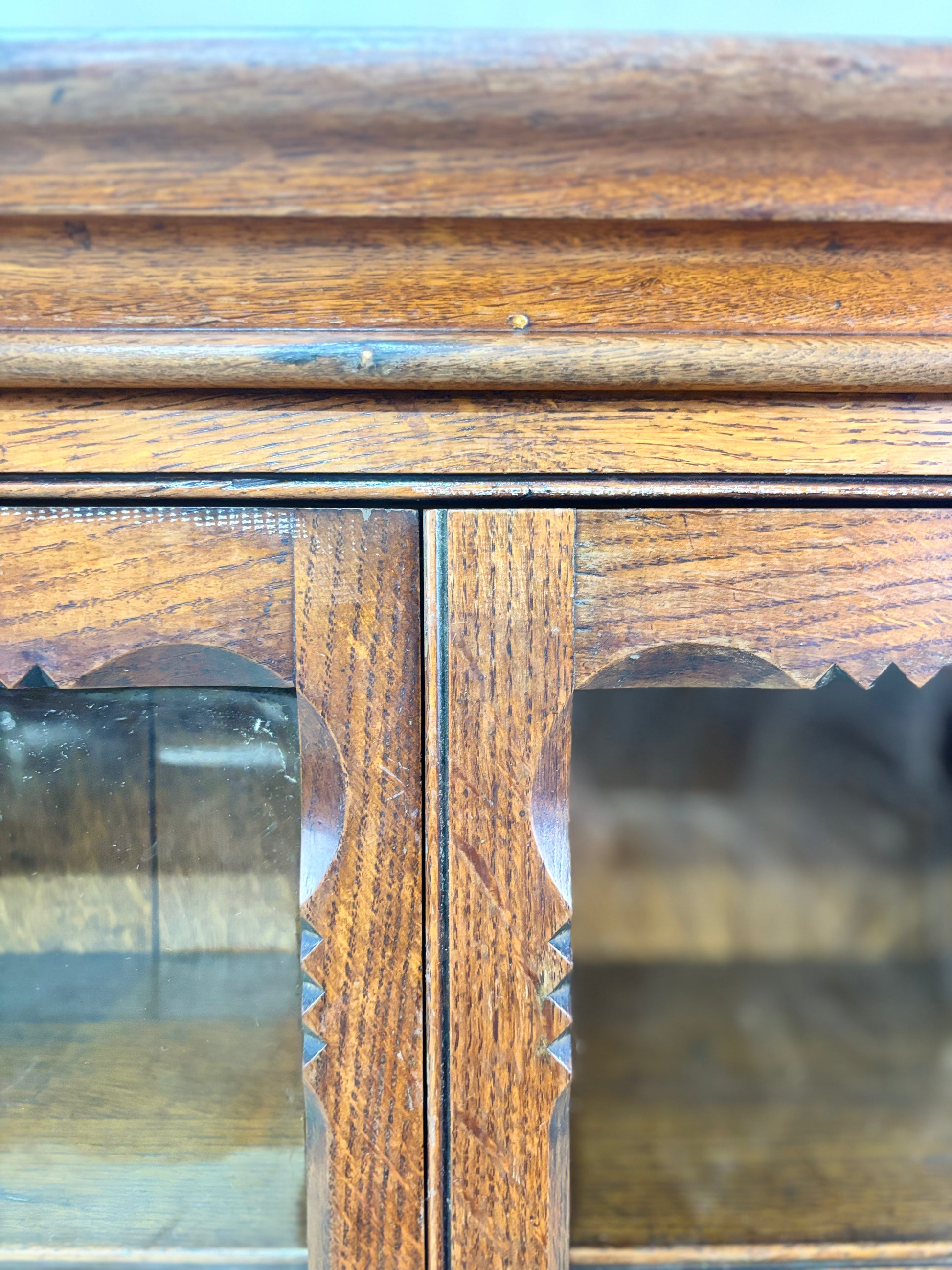 Close-up of a wooden cabinet with glass panels