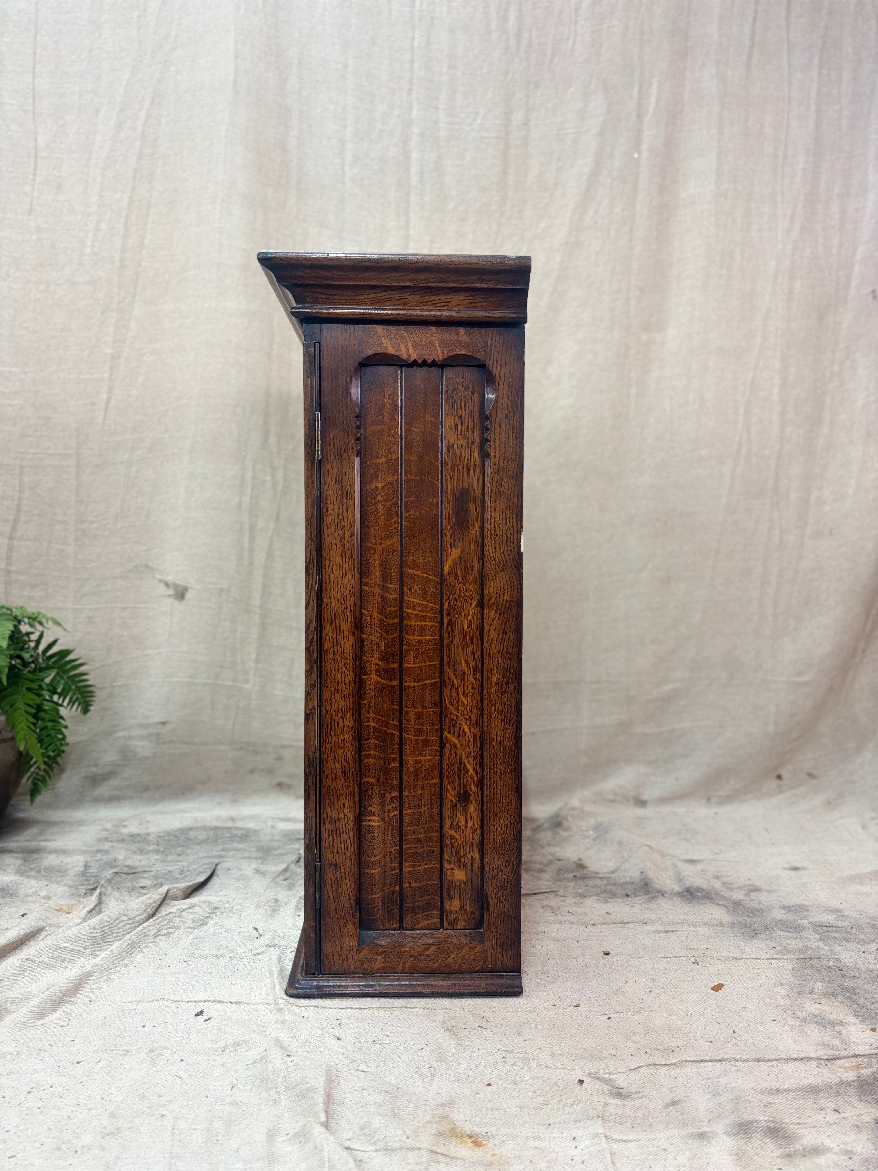 Wooden pedestal on a textured white background