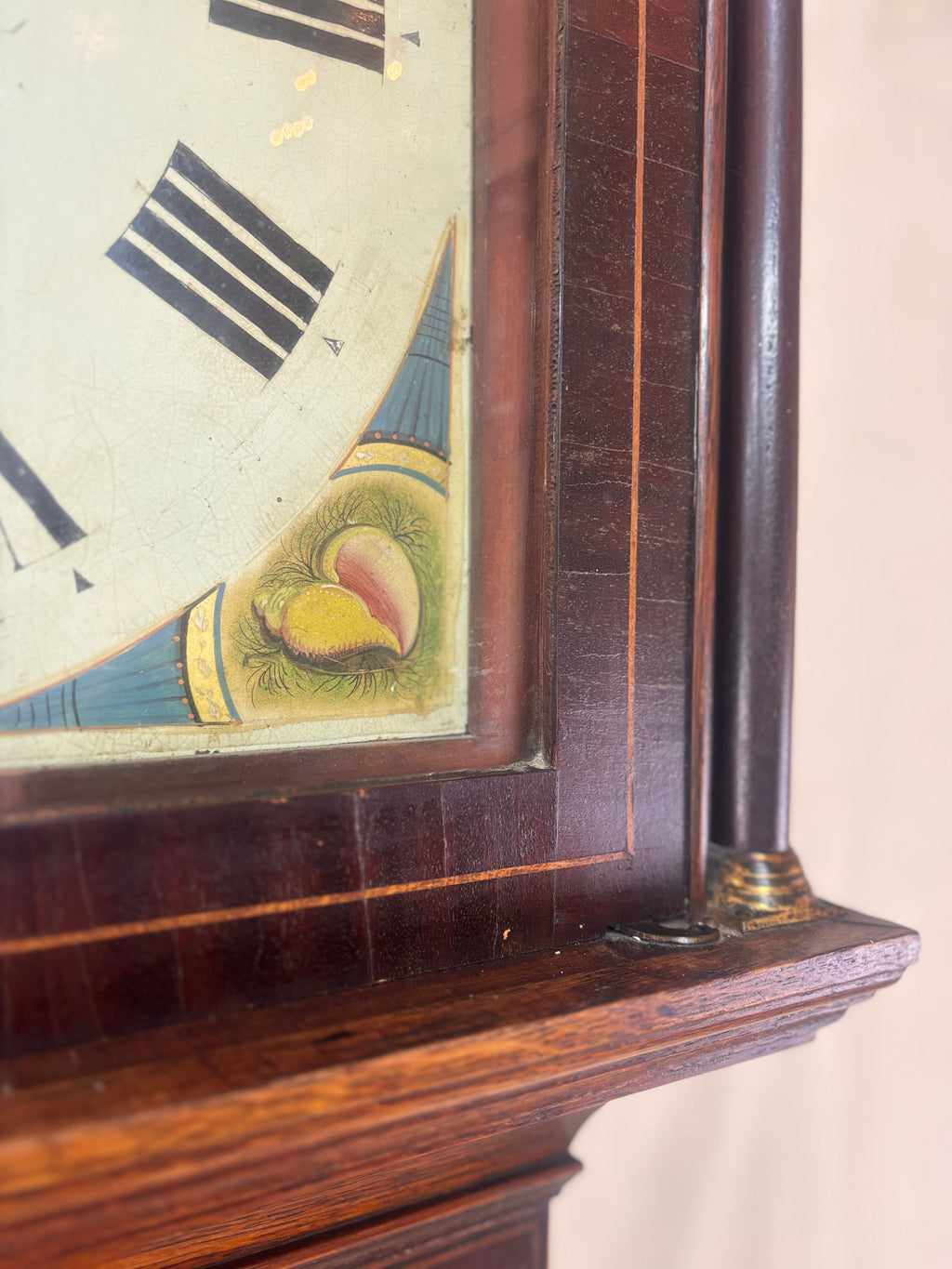 Corner of a grandfather clock face